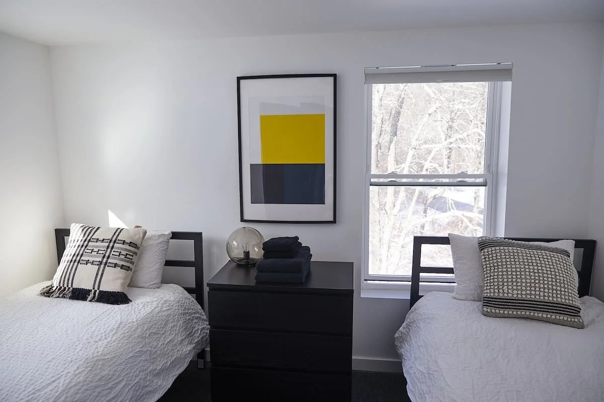 A bedroom with two single  beds, at Blackbear cottage-Comfortable guest bedrooms at Black Bear Cottage – 4-bedroom Catskills vacation home for up to 8 guests