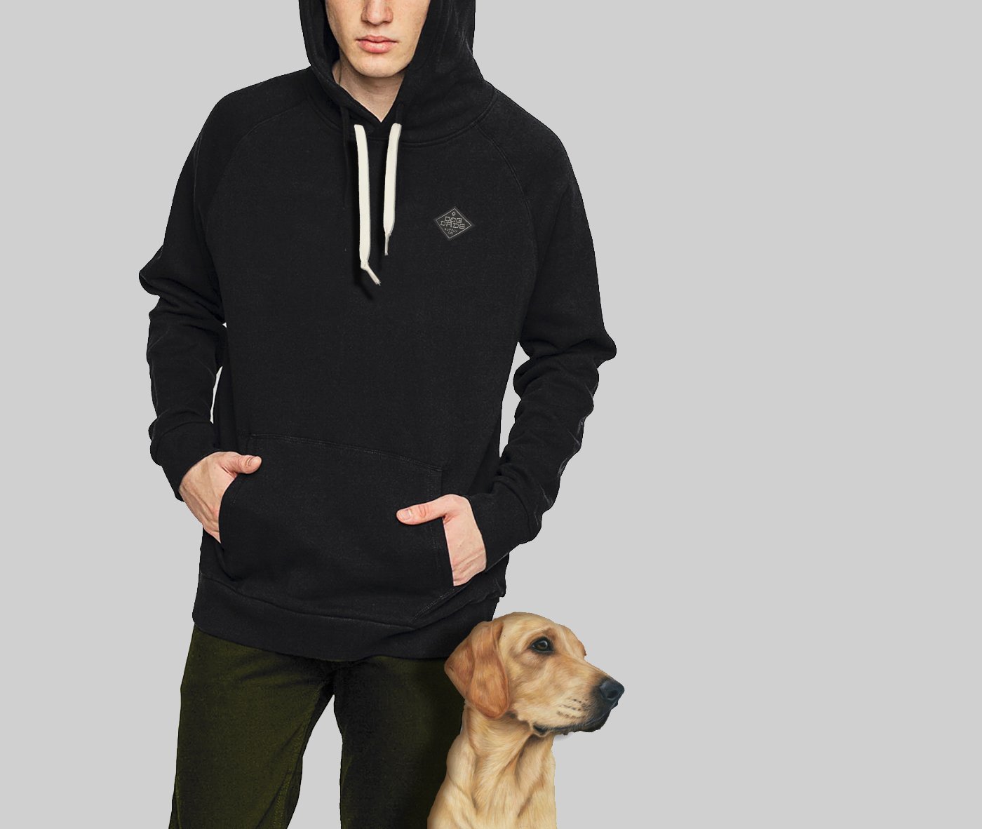 Person in a black hoodie with a dog at their side, against a light gray background.
