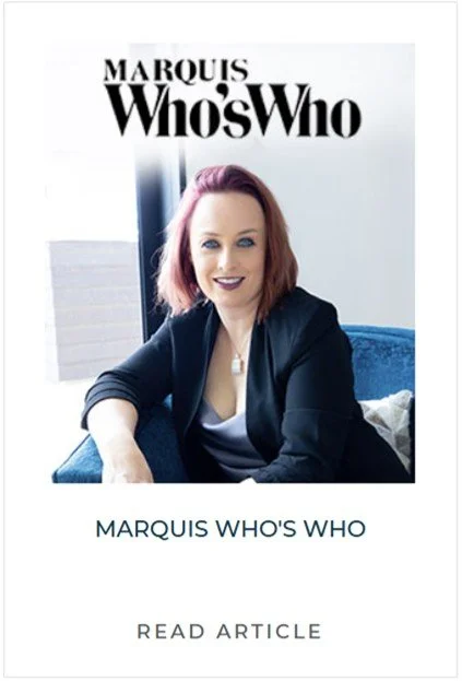 Book cover titled "Marquis Who's Who" featuring a woman with shoulder-length reddish-brown hair, wearing a dark blazer and a white top, sitting on a blue couch with a white pillow behind her, in a well-lit room.