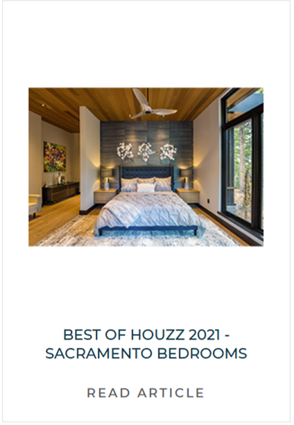 Interior of a modern bedroom with a large bed, wooden ceiling, a ceiling fan, large windows showing greenery outside, and contemporary decor.