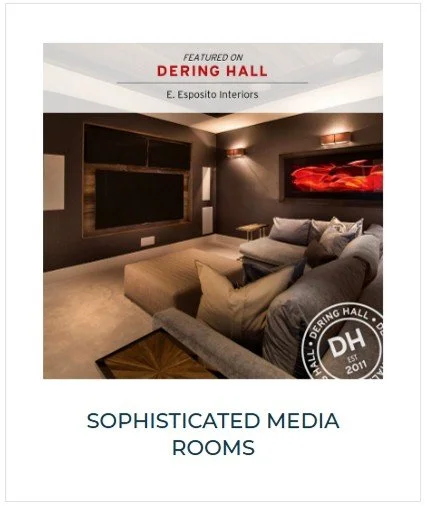 A modern media room with a large flat-screen TV, comfortable sofa, and wall art, showcasing an elegant interior design.