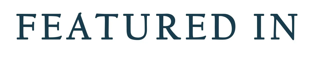 Text reading 'FEATURED IN' in large blue letters on a white background.