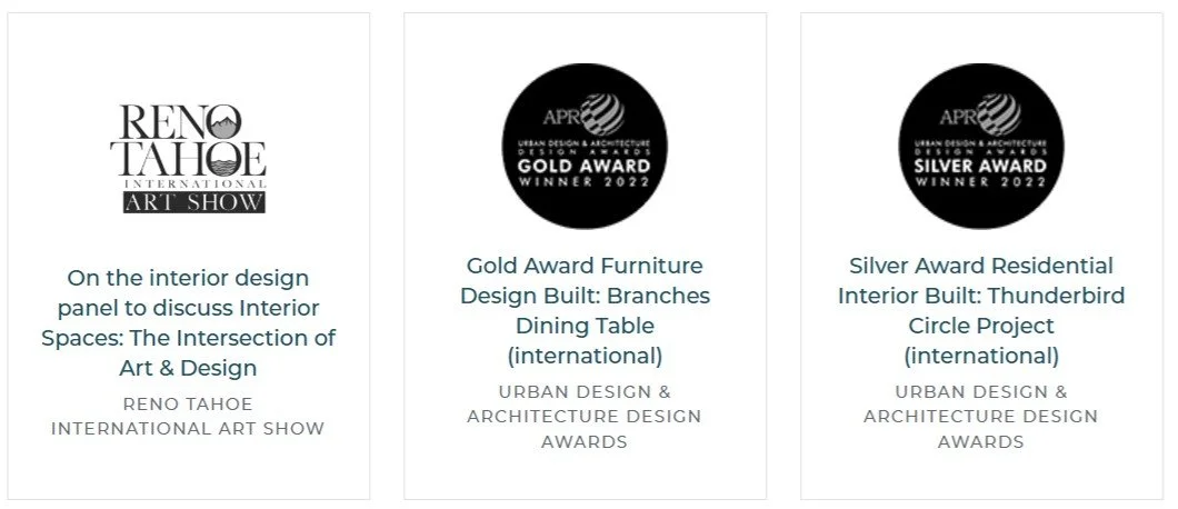 Three award badges and descriptions from the 2022 Urban Design & Architecture Design Awards. The first badge is for the Reno Tahoe International Art Show interior design panel. The second badge is for a gold award for a branches dining table project. The third badge is for a silver award for a Thunderbird Circle residential interior project.
