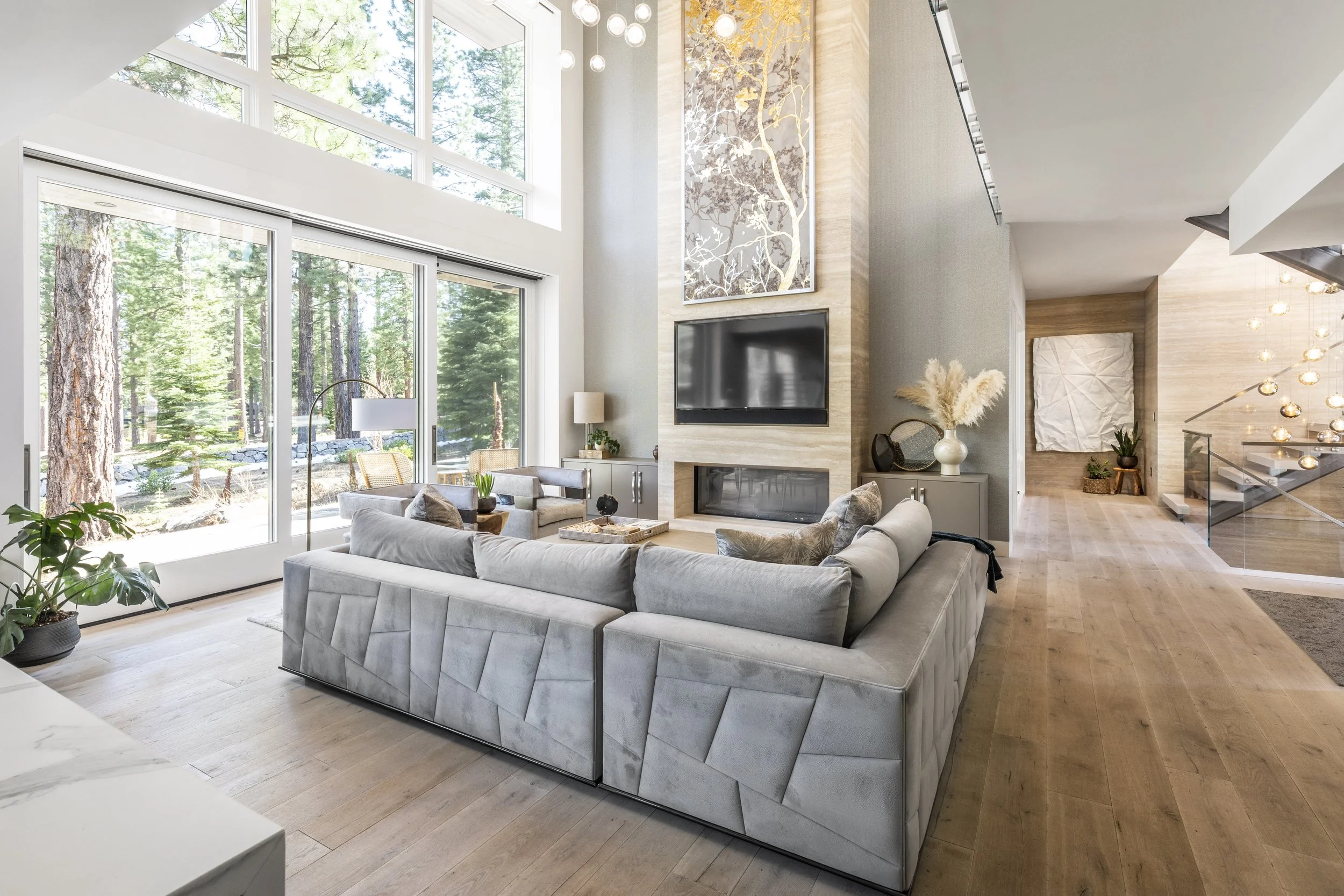 Mountain modern great room with natural stone fireplace in Martis Camp Truckee CA