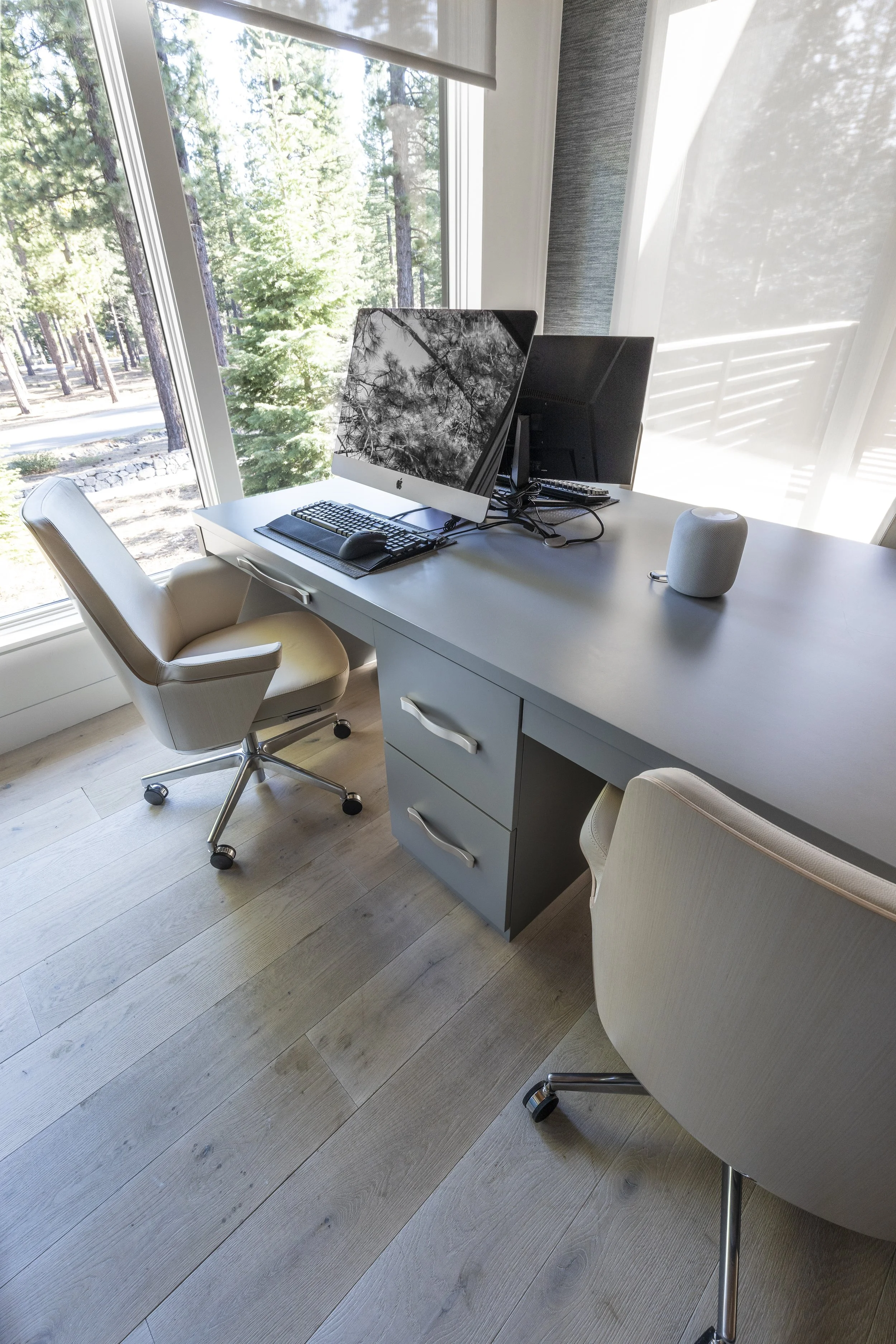 Mountain modern bright media and family room with a custom 4 person desk and walls covered in two textured and natural wallpapers in Martis Camp in Truckee, CA.