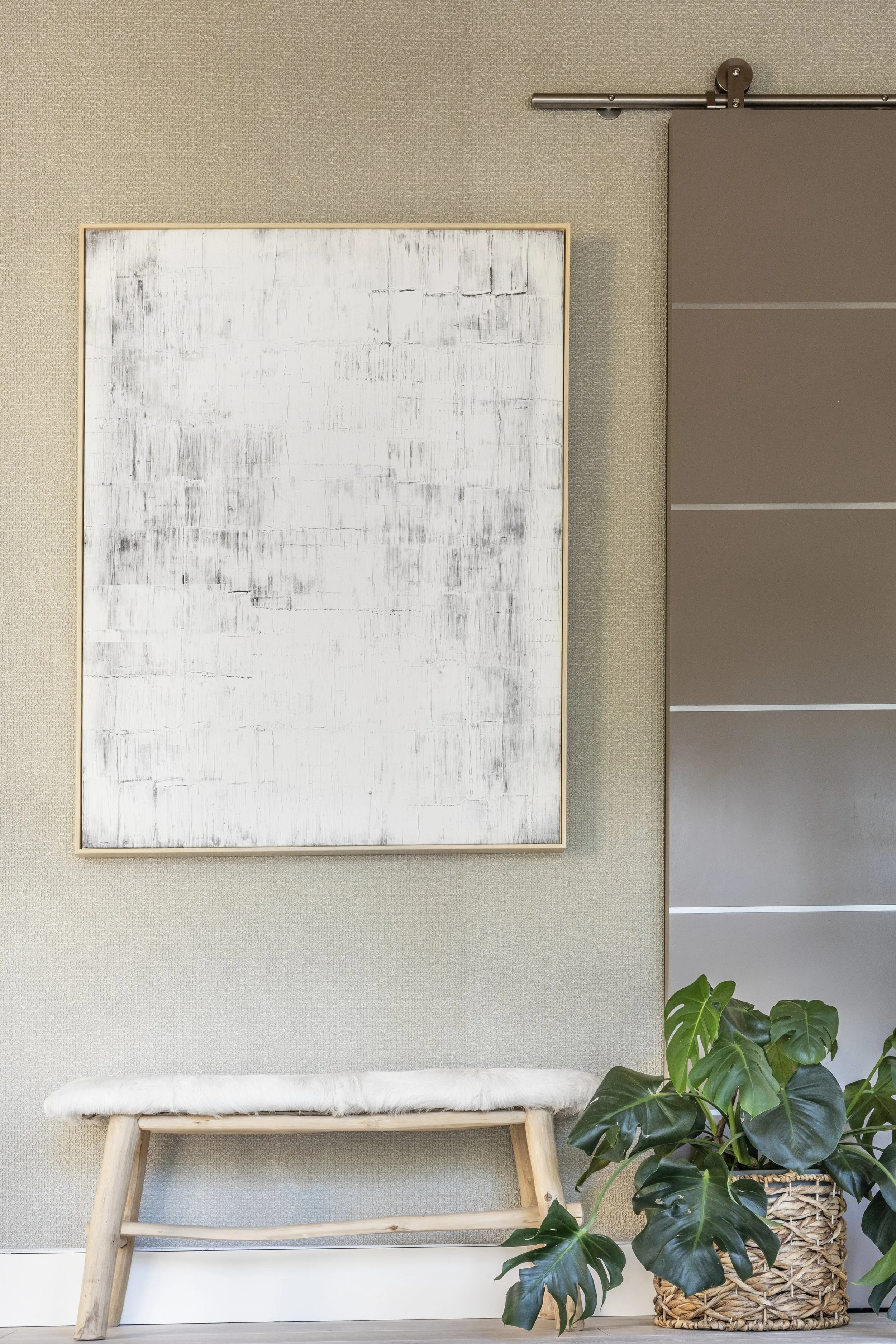 Light and airy mountain modern stair landing with textured wallpaper in Martis Camp