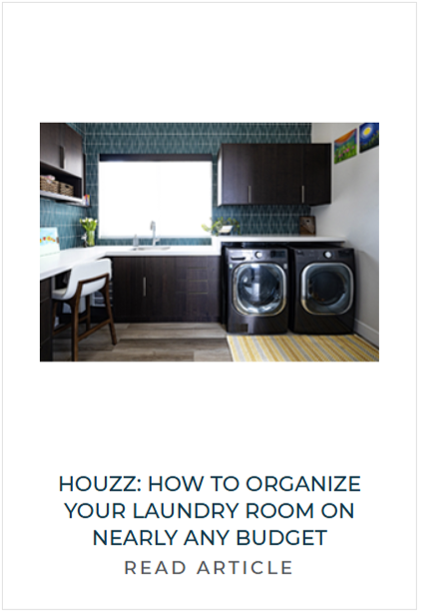Laundry room with dark cabinets, washing machine and dryer, window, and some decorative items