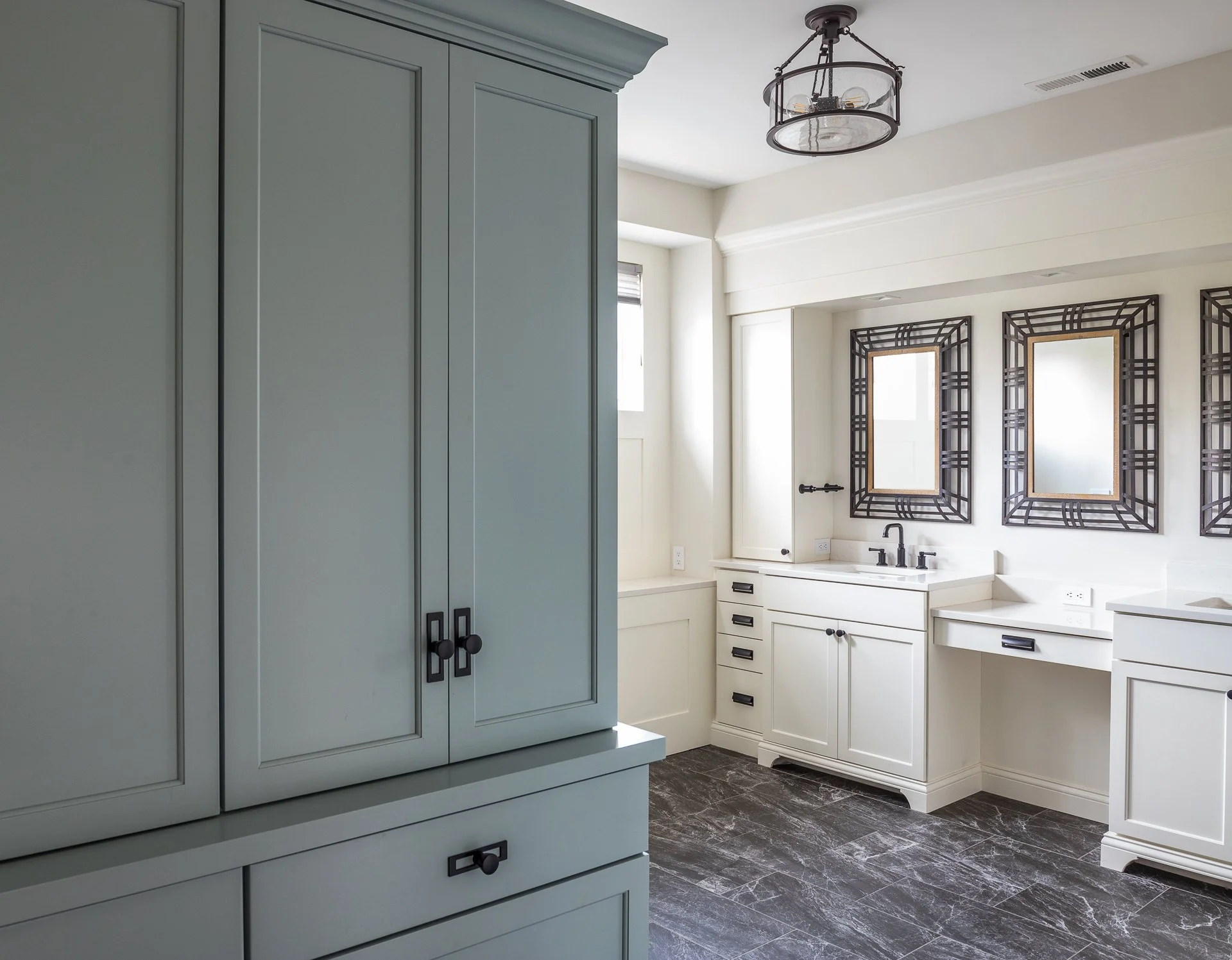 bathroom with blue and white cabinets