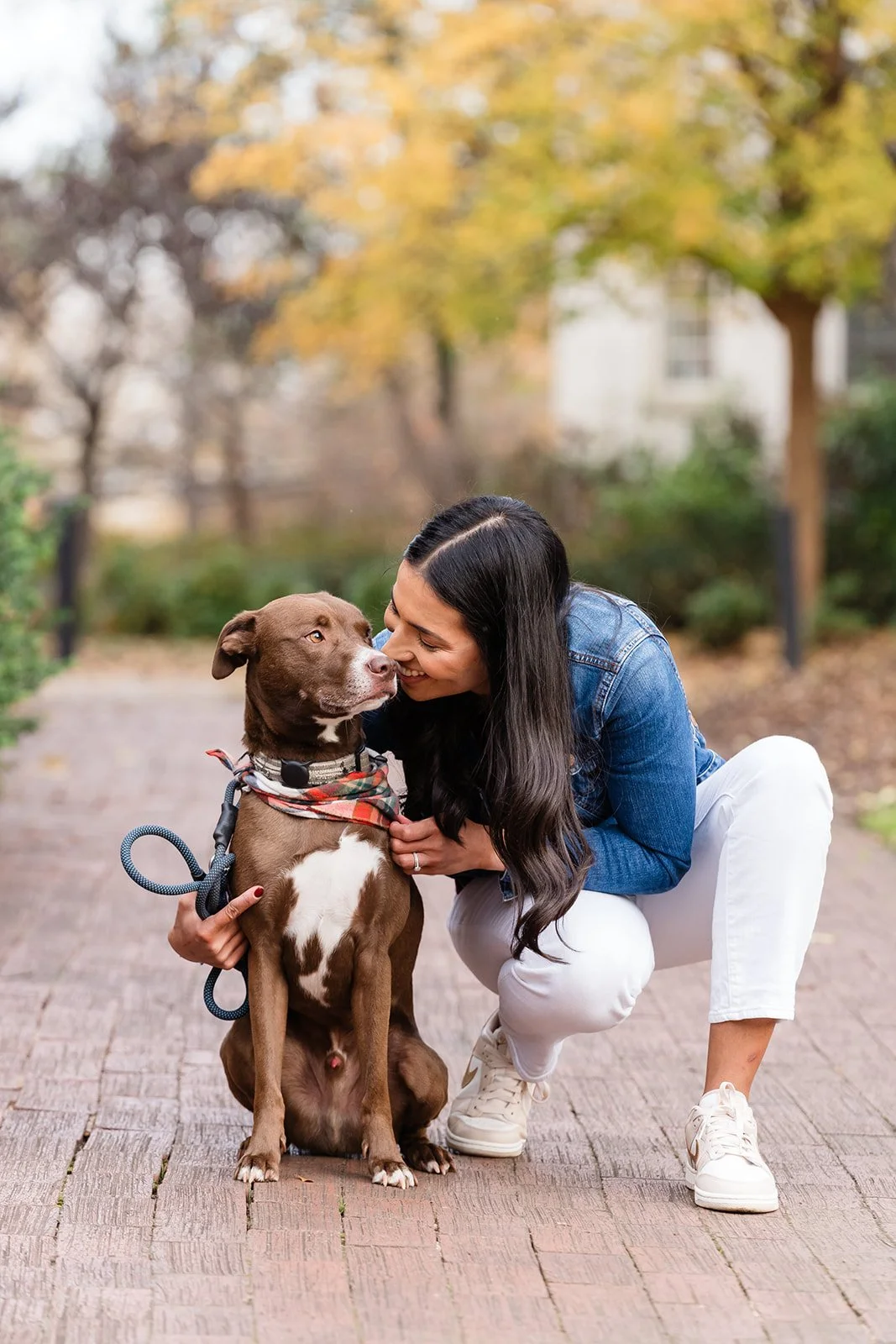 Lenet snuggles her brown dog