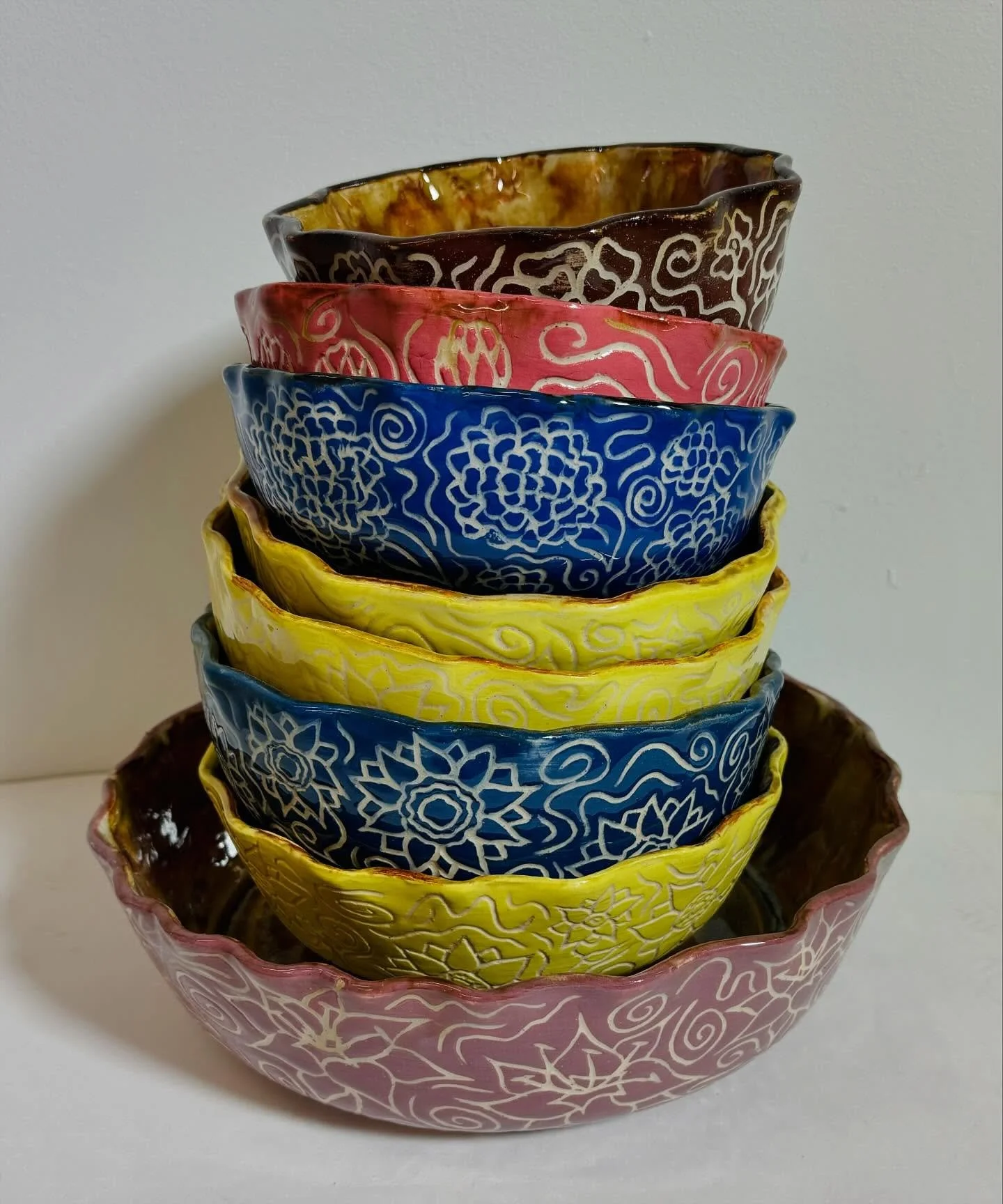 bowls bowls bowls!!! a set of bowls with the women in my family&rsquo;s favorite flowers!! i used the sgraffito technique to carve the flowers onto each bowl :D super fun but so time consuming! i don&rsquo;t love how the inside of the bowls turned ou