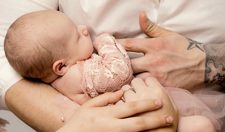 parent and newborn hands and tattoo.jpg