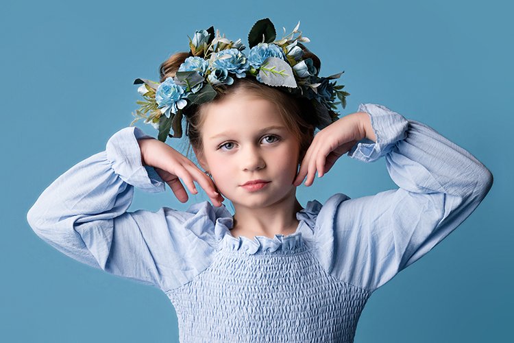 child portrait of girl on blue.jpg