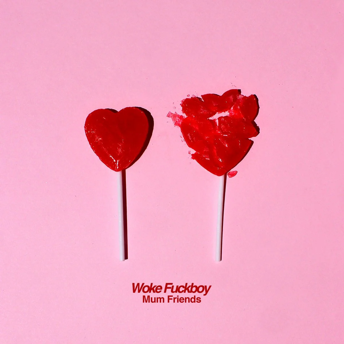 Two red heart-shaped lollipops on pink background, one intact and one broken, with red text reading 'Woke Fuckboy Mum Friends'.