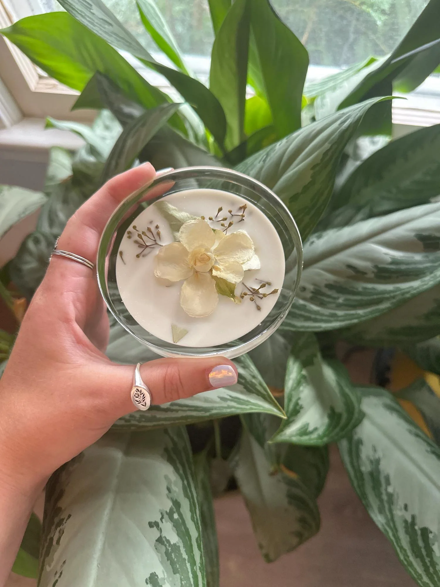 Resin highball coaster preserving a white wedding flower, handmade by Beaux’s Botanical Preservation in the Outer Banks