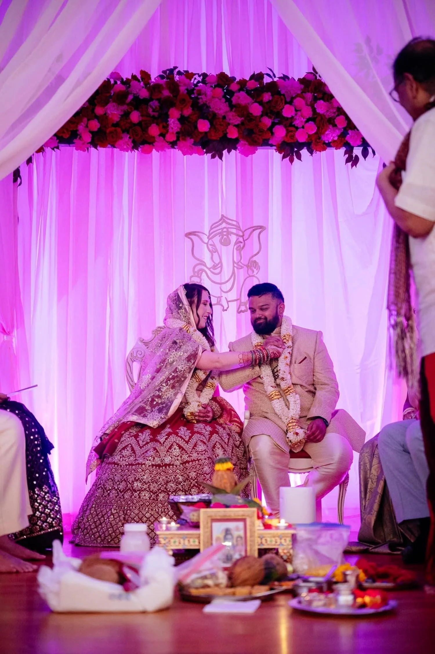 Wedding couple celebrating with vibrant florals during their reception, later preserved by Beaux’s Botanical Preservation in the Outer Banks