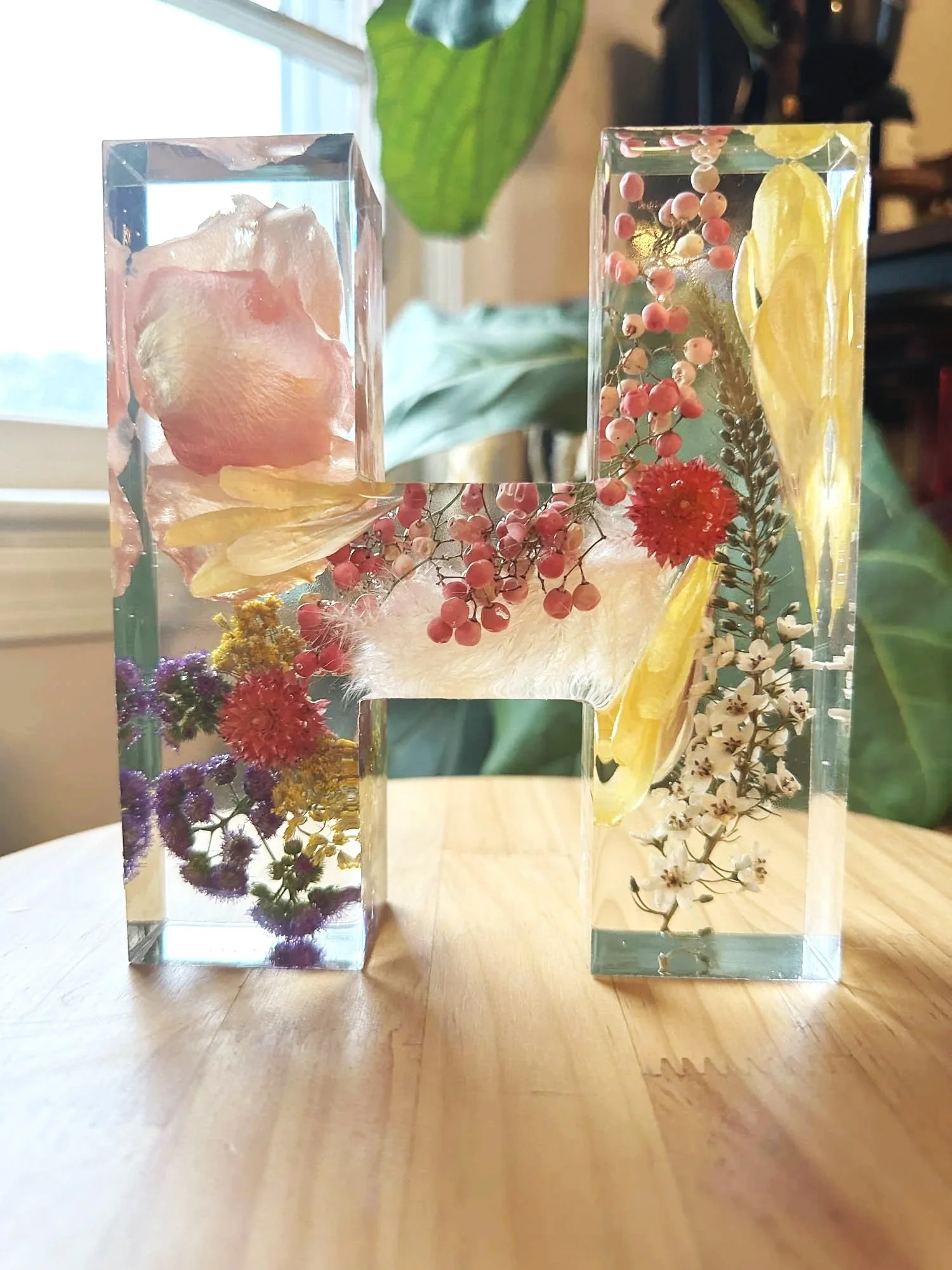 Custom resin H initial block preserving wedding flowers, handcrafted by Beaux’s Botanical Preservation in Outer Banks NC