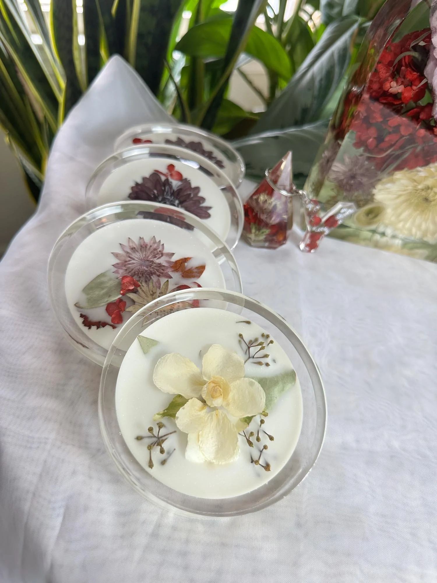 Set of resin highball coasters containing preserved wedding flowers, handcrafted by Beaux’s Botanical Preservation in the Outer Banks