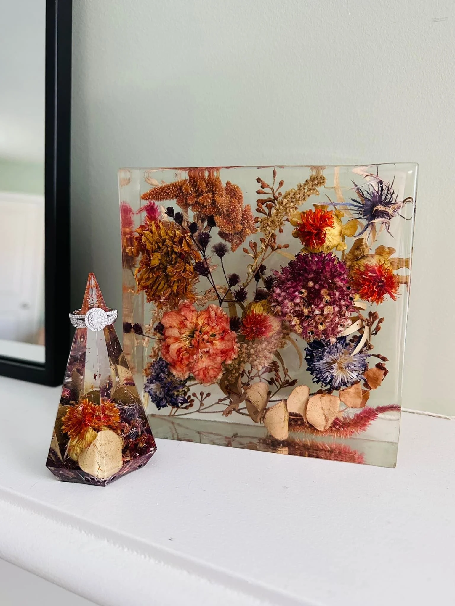 Diamond-shaped ring display and rectangular resin block preserving autumn-toned flowers, created by Beaux’s Botanical Preservation in Outer Banks NC