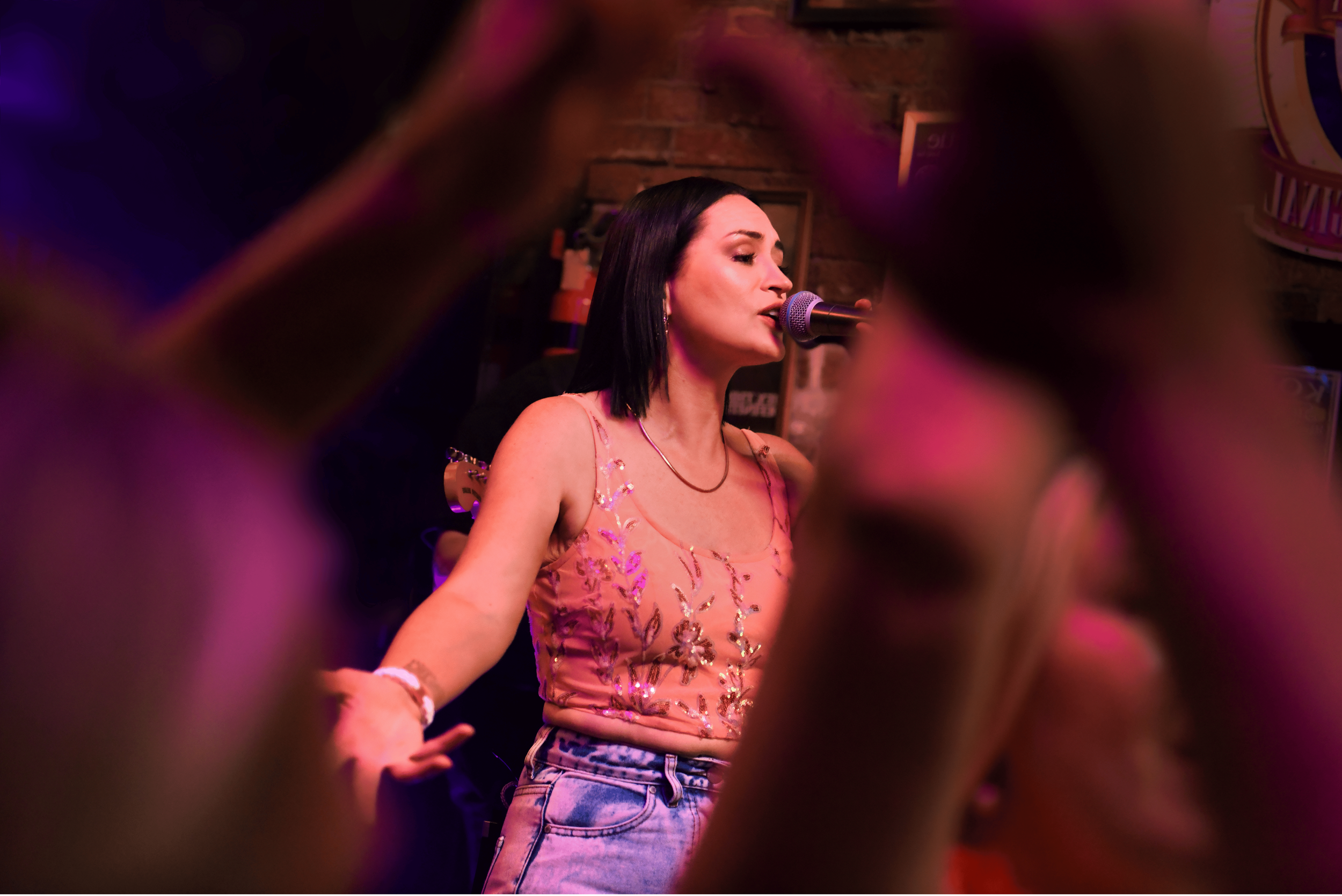 Under the Covers® live performance at a crowded Suzie Wong's Good Time Bar