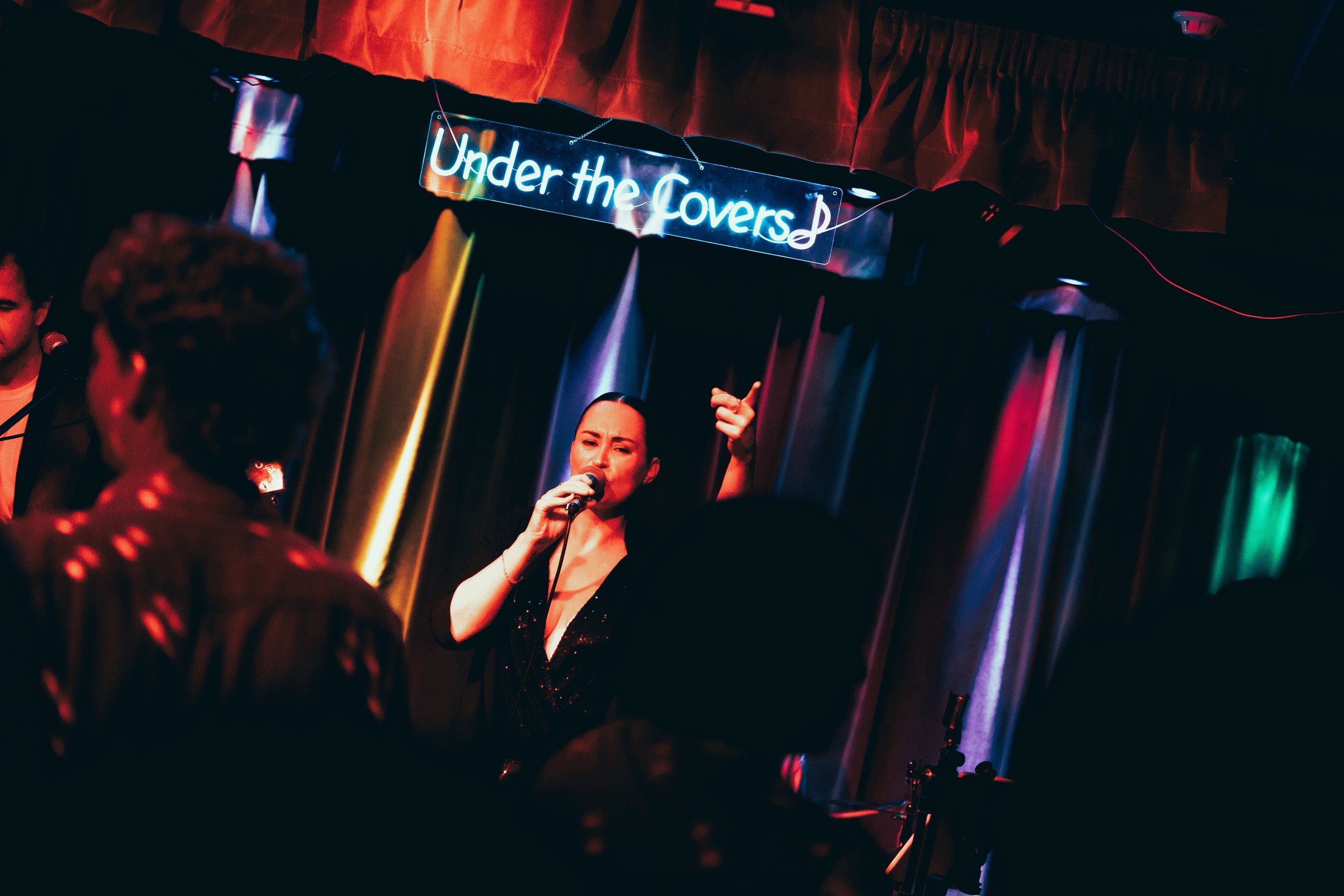 Under the Covers® lead singer Shelley Davies performs for an audience in Brisbane