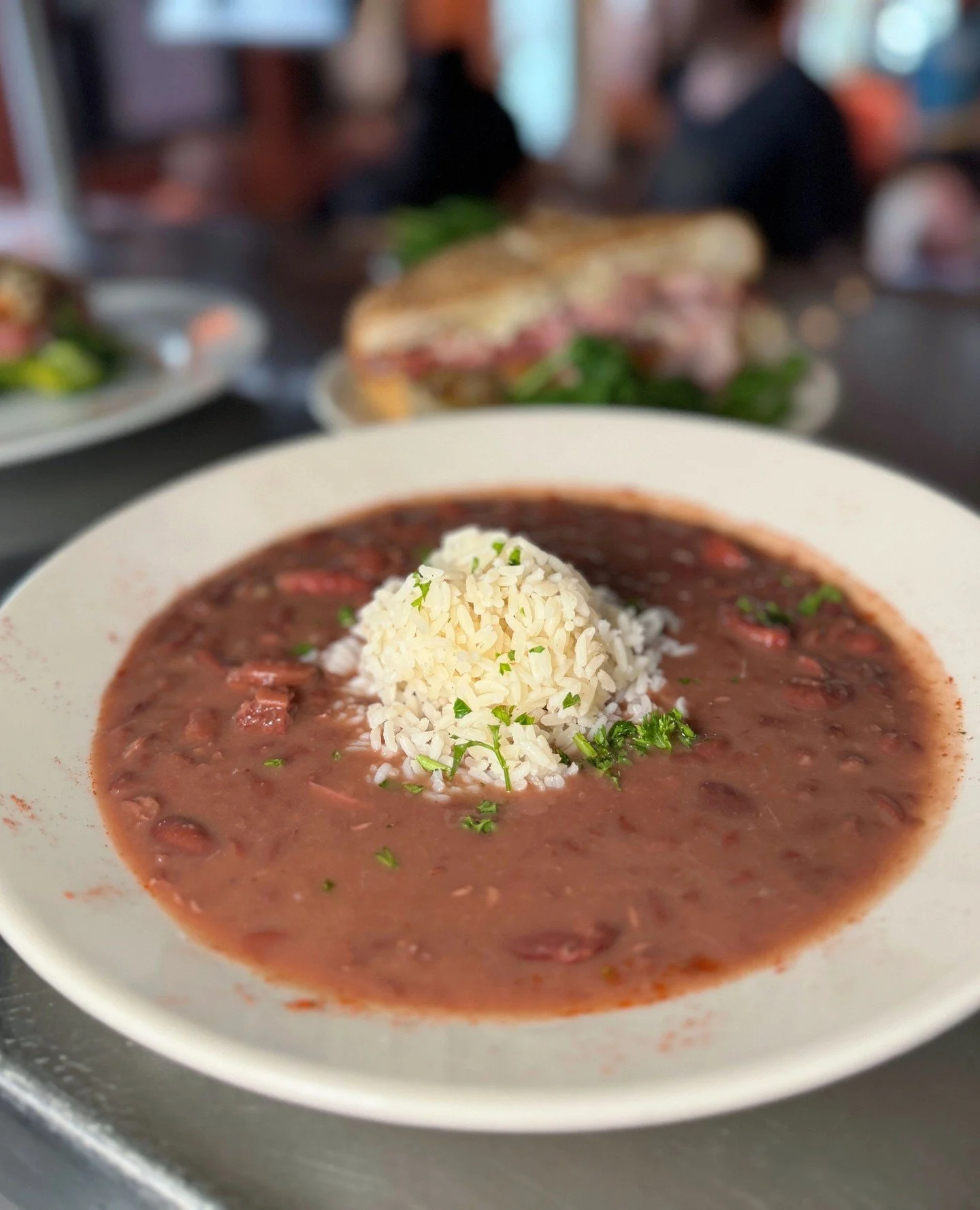 Monday mood, you already know 💜 Fresh batch of your weekly beans awaits at Katie's.⁠
⁠
#neworleansrestaurant #comfortfood #casualdining