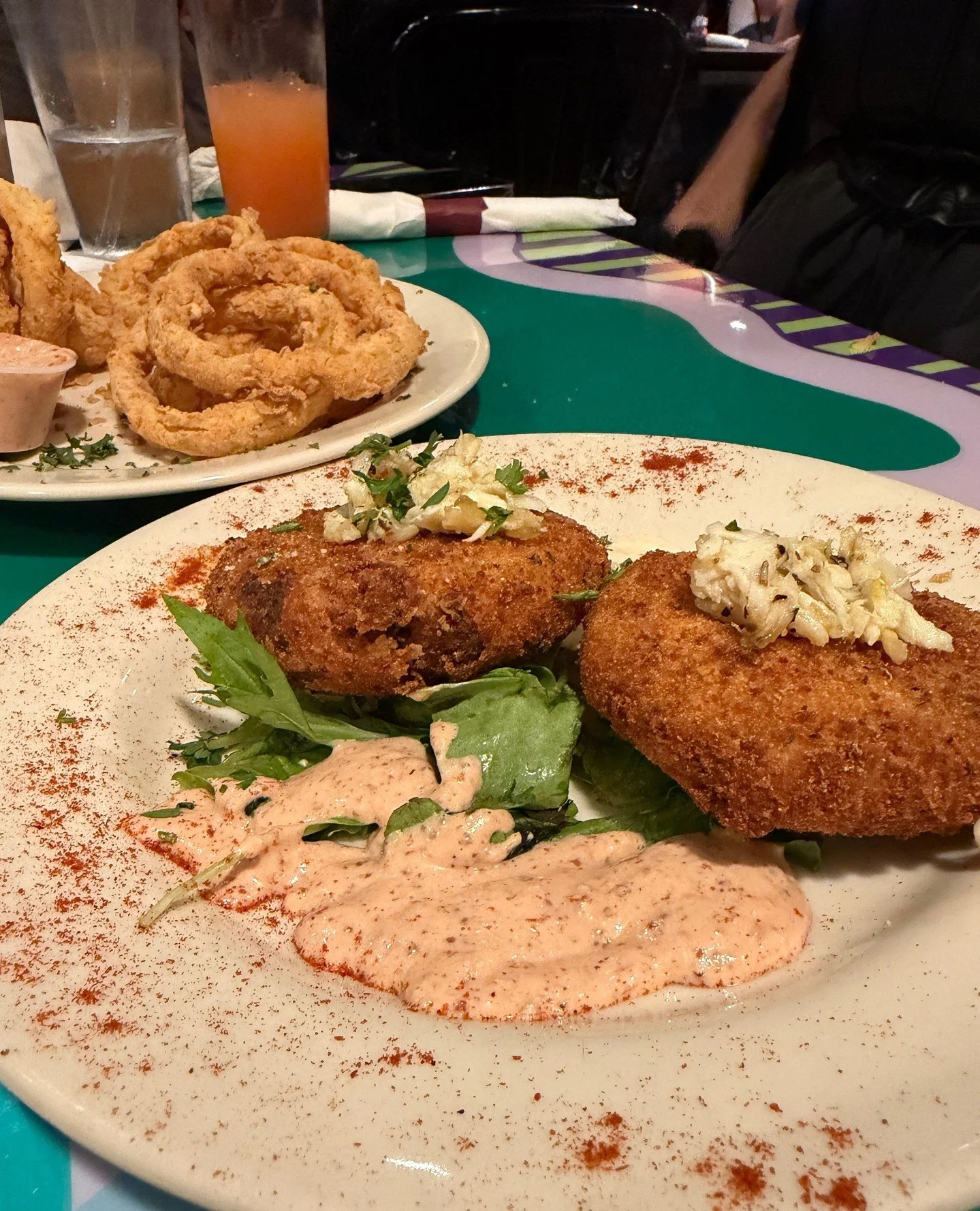 Mood for today is crab cakes &amp; onion rings, yes please! There's no bad way to get the table started at Katie's 🦀🍟💜⁠
⁠
#neworleansrestaurant #comfortfood #casualdining