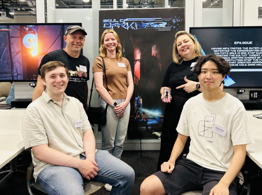 A photo of the Soul of Darkness team showcasing the game