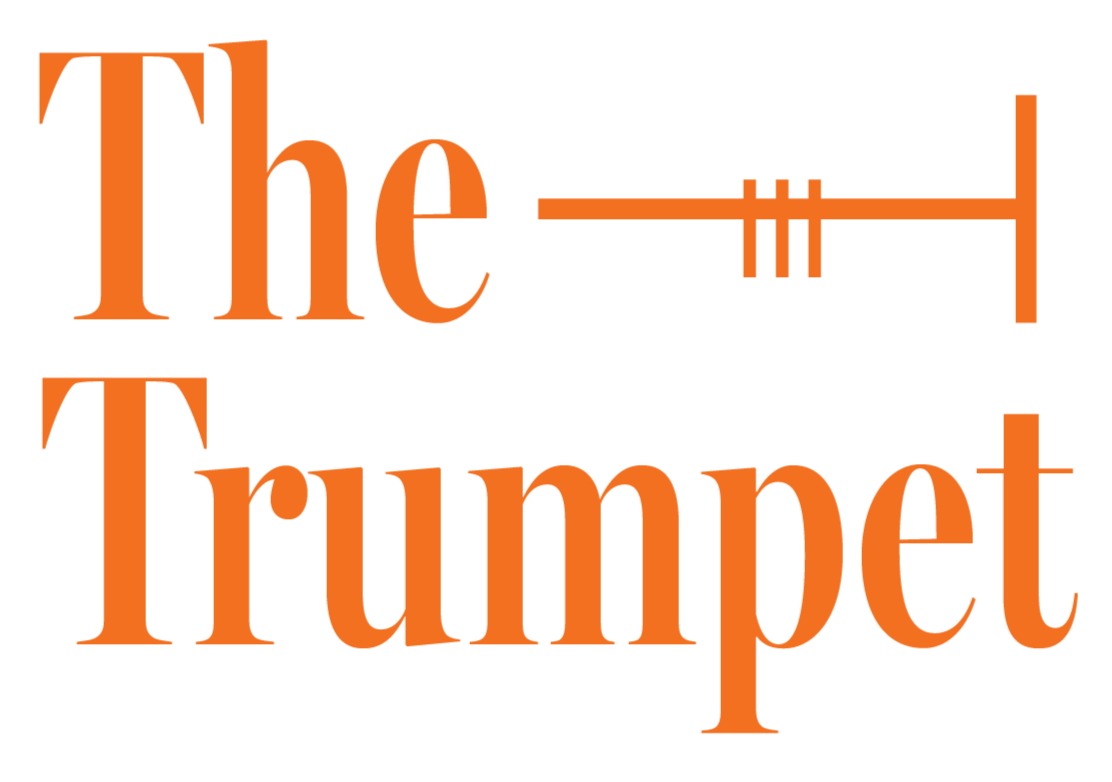 Wartburg College's logo for their newspaper, "The Trumpet", in large orange letters with a trombone illustration integrated into the text.