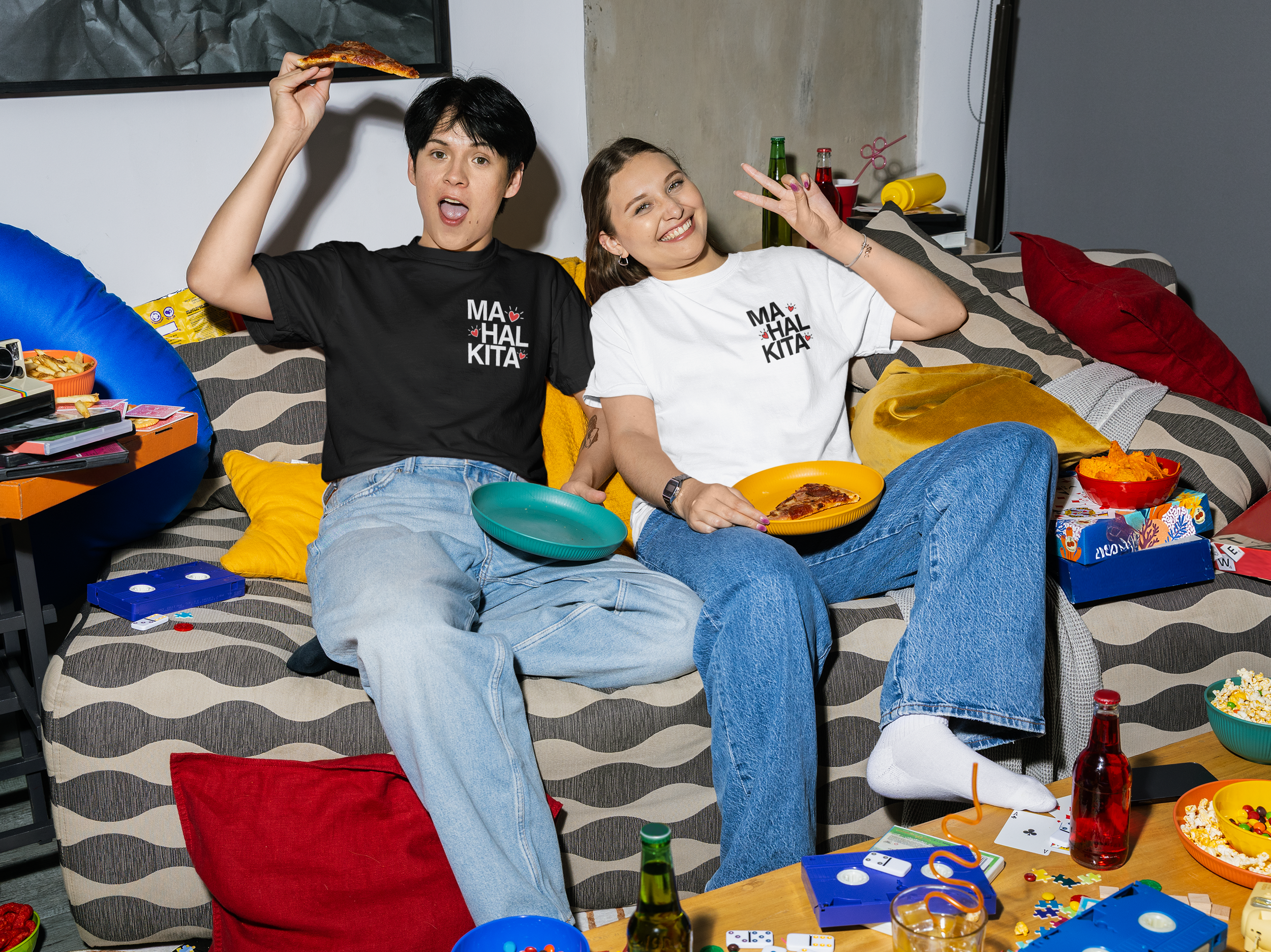comfort-colors-t-shirt-mockup-of-a-smiling-woman-and-a-man-eating-pizza-on-a-couch-m58536.png
