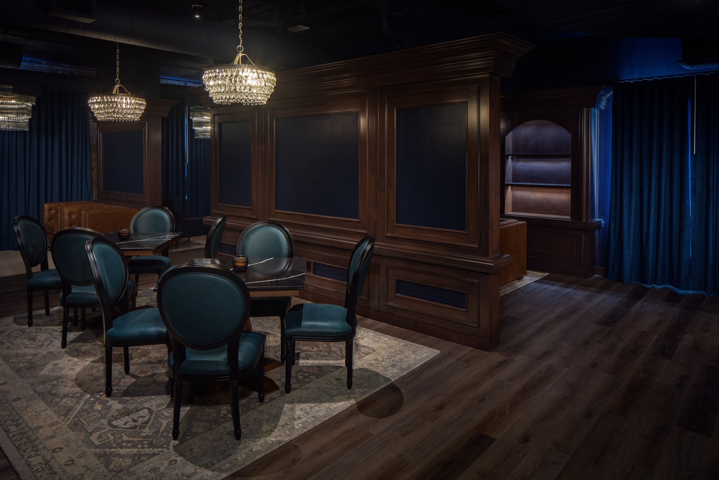 Table seating at Archer, the speakeasy at The Clara Hotel in Plano, Texas.