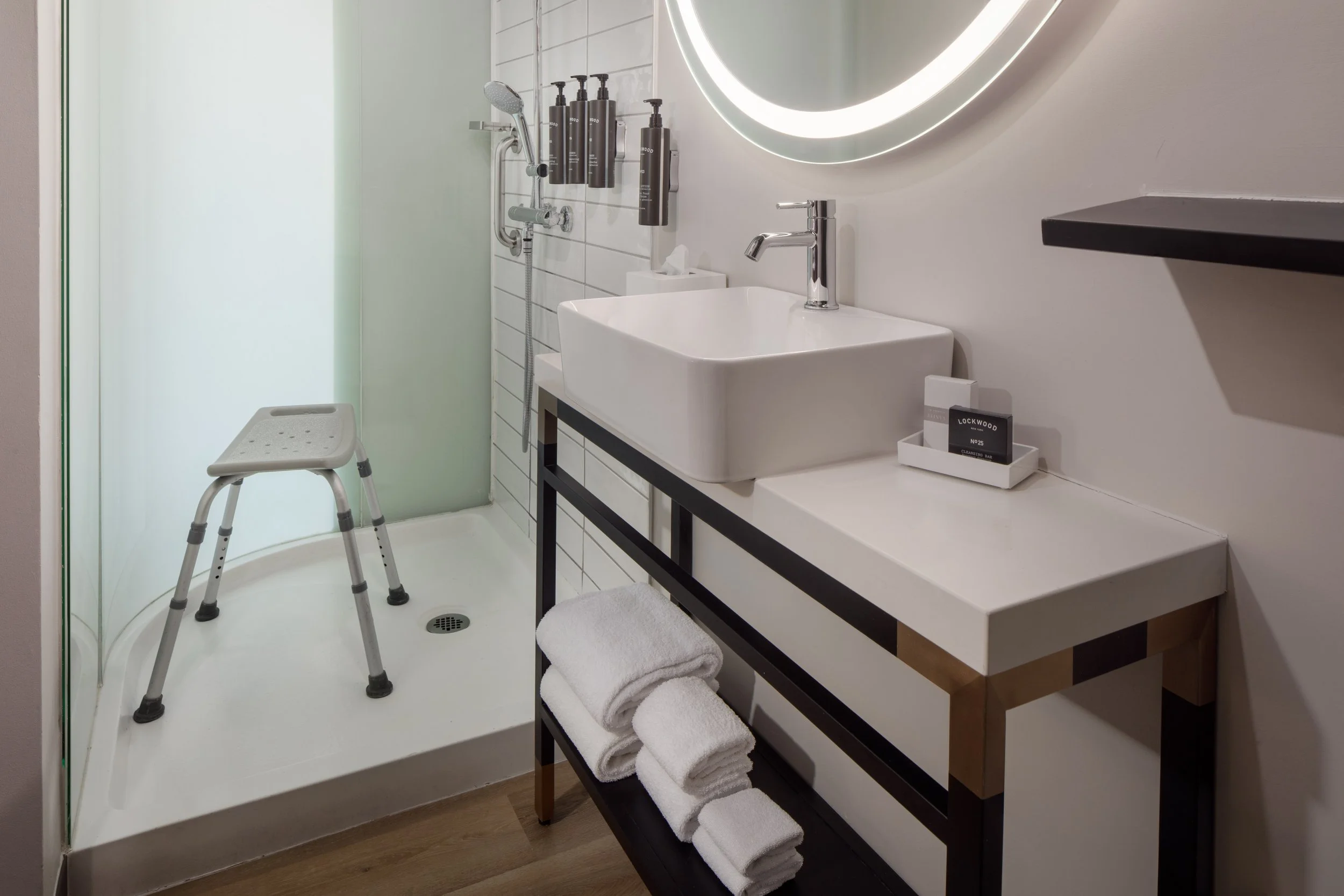 Accessible shower in the King Bed Accessible Shower Room at The Clara Hotel in Plano, Texas.