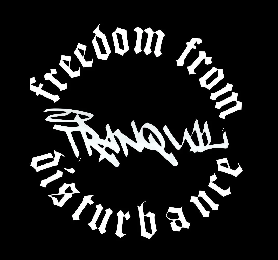 Stylized circular text in black and white that reads "Freedom from Disturbance" with a dark background.