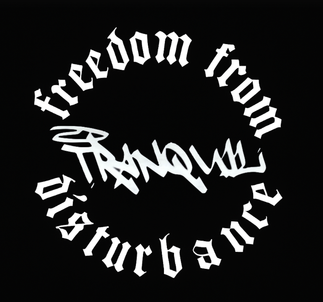 Stylized circular text in black and white that reads "Freedom from Disturbance" with a dark background.