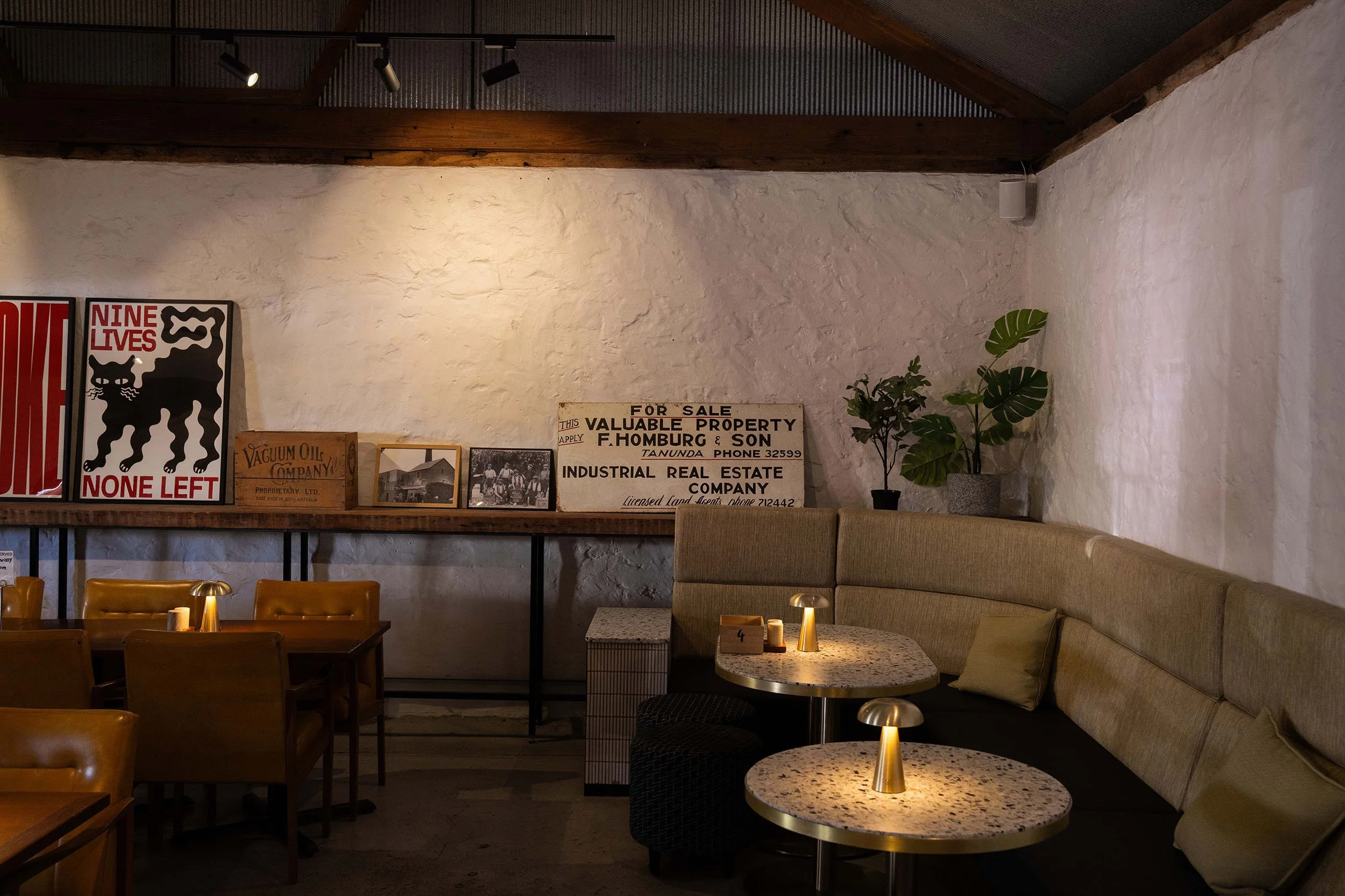 Interior of Old Mill Brewery in Tanunda Barossa Valley with seating, warm lighting and rustic bar setting.