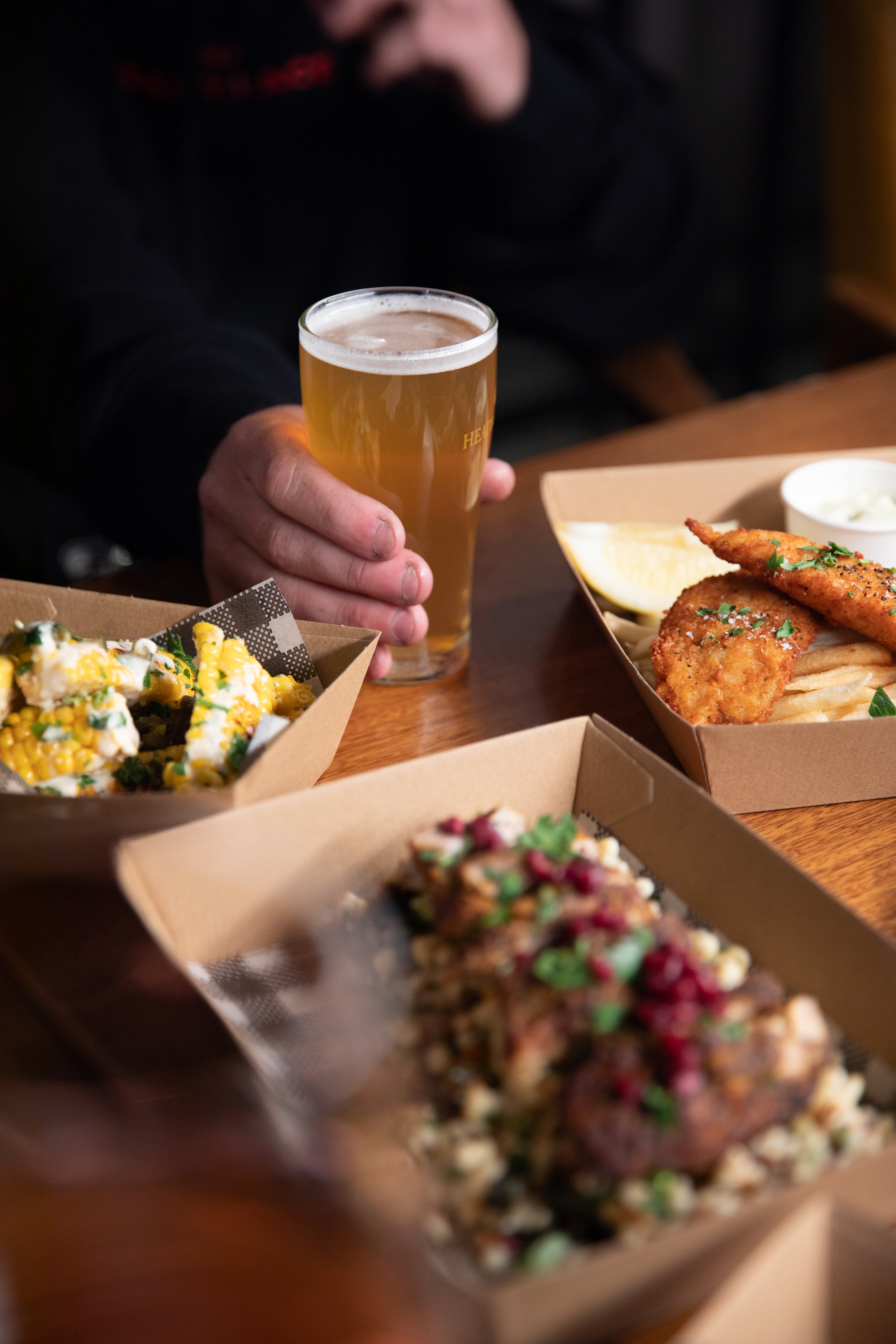 Pub-style fish and chips, Moroccan chicken grain salad and a pint of beer at Old Mill Brewery in Tanunda, Barossa Valley, showcasing authentic pub food in a relaxed brewery setting.