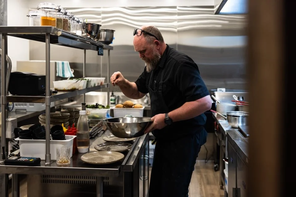 Head Chef Kane Boase from Sally Can Wait cooking in the kitchen at Old Mill Brewery, Tanunda Barossa Valley, showcasing authentic pub food and dining experience.