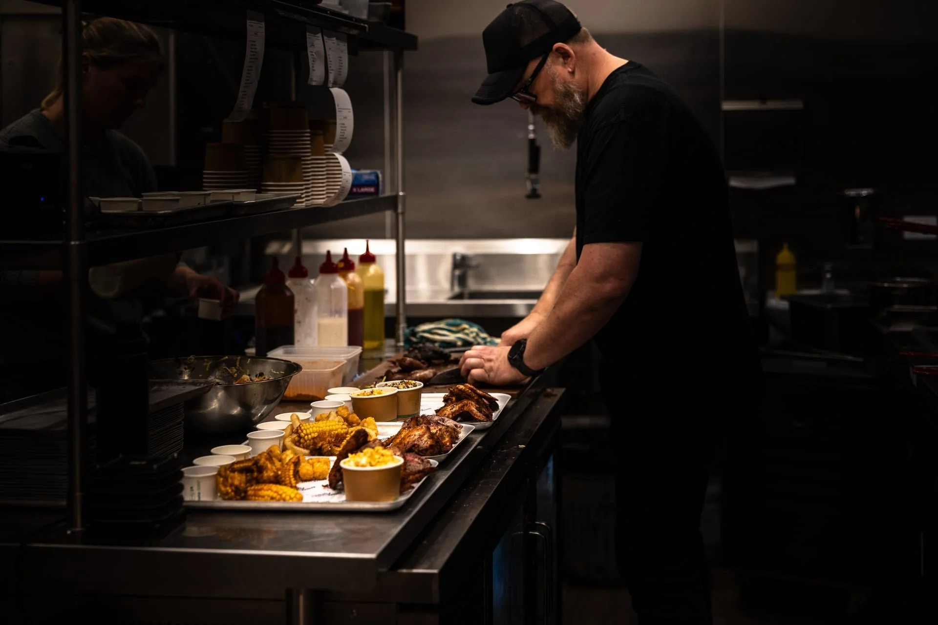 Sally Can Wait preparing Texas Style BBQ and southern sides at Old Mill Brewery with smoked meats, fried chicken and fresh barbecue dishes served during the American-style BBQ experience in Tanunda, Barossa Valley.