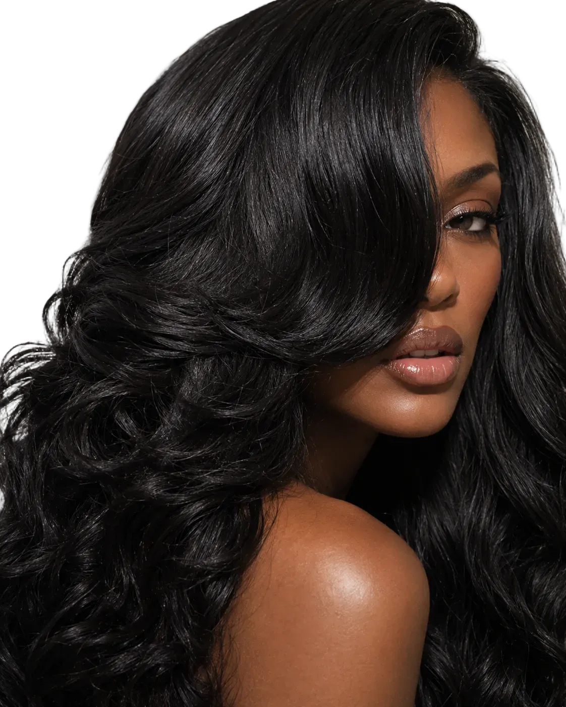 Woman wearing long, voluminous black wavy hair extensions after a sew-in install
