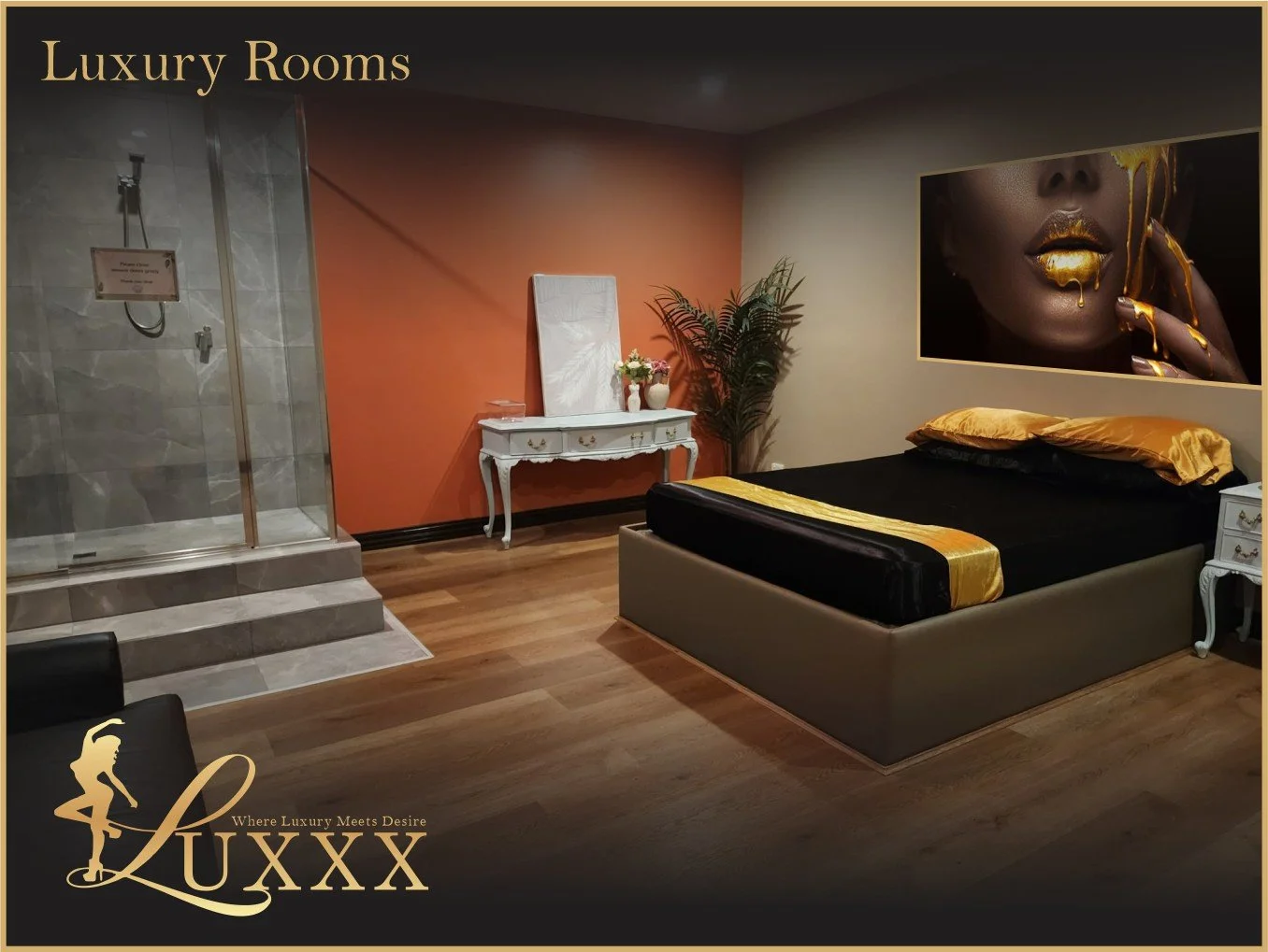 Luxurious bedroom with black and gold bedding, a large art piece of a woman's face with gold accents, a white ornate dresser, a potted plant, and a glass-enclosed shower area in the corner. Logo in the bottom left corner that says 'LUXXX' with the tagline 'Where Luxury Meets Desire'.