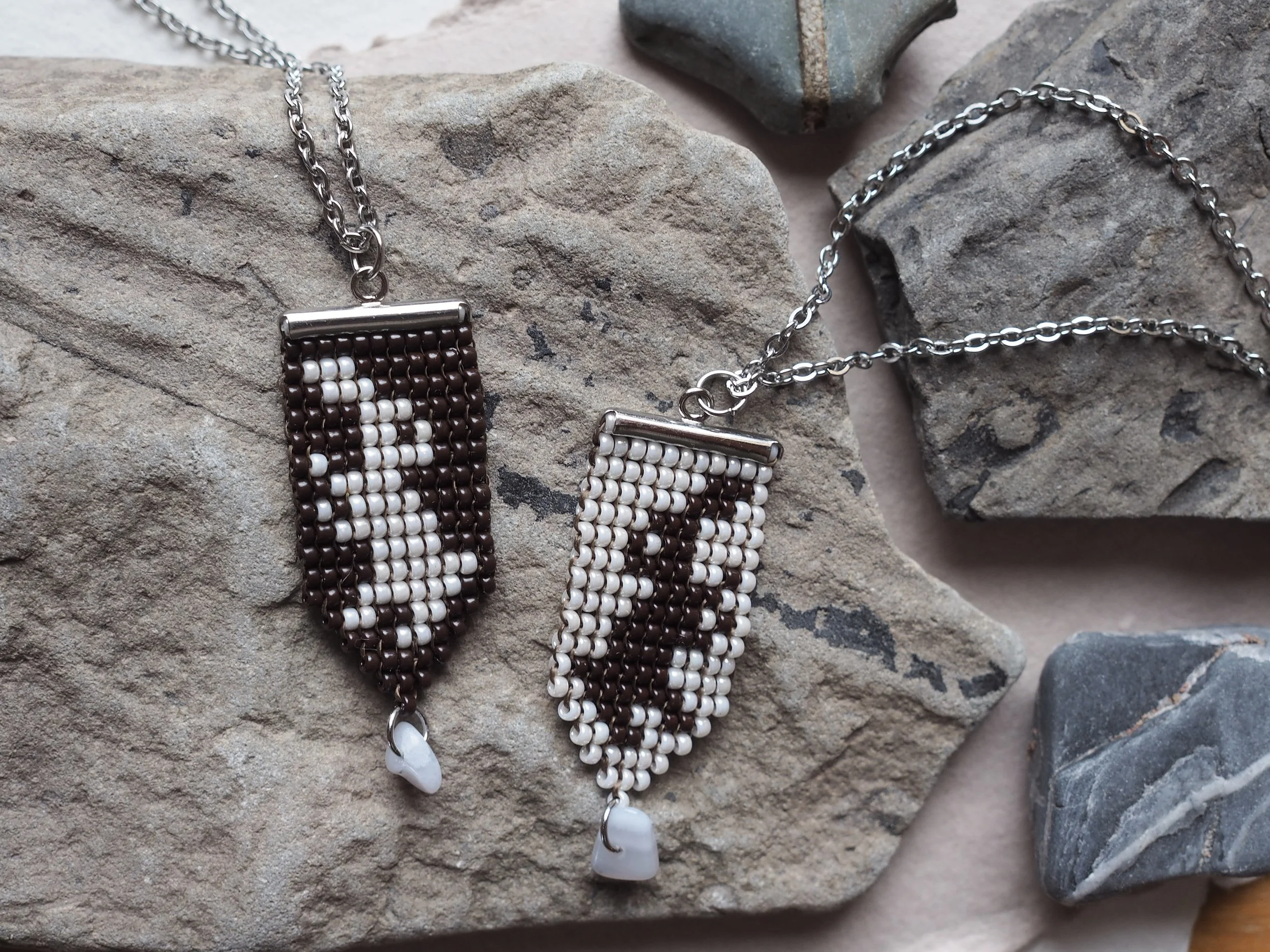 Duelling Rabbits: 11/0 miyuki beads, silver plated clasp, 24" stainless steal chain