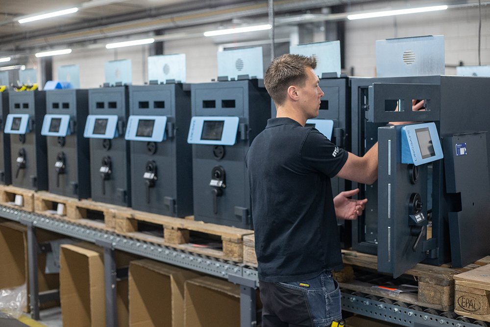 A Cennox worker building Cennox smart safes.