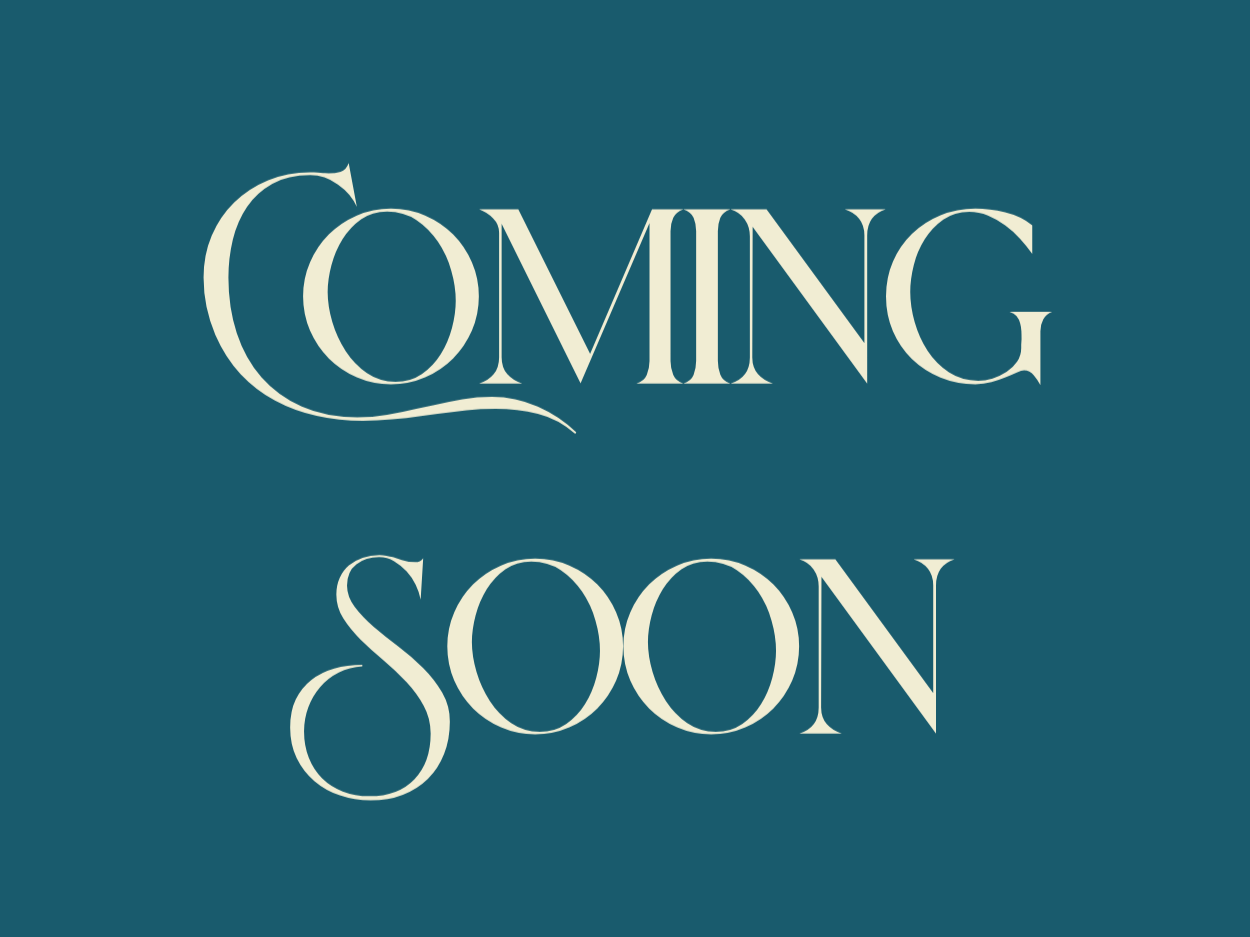 Gray background with the words 'Coming Soon' in large, elegant white font.