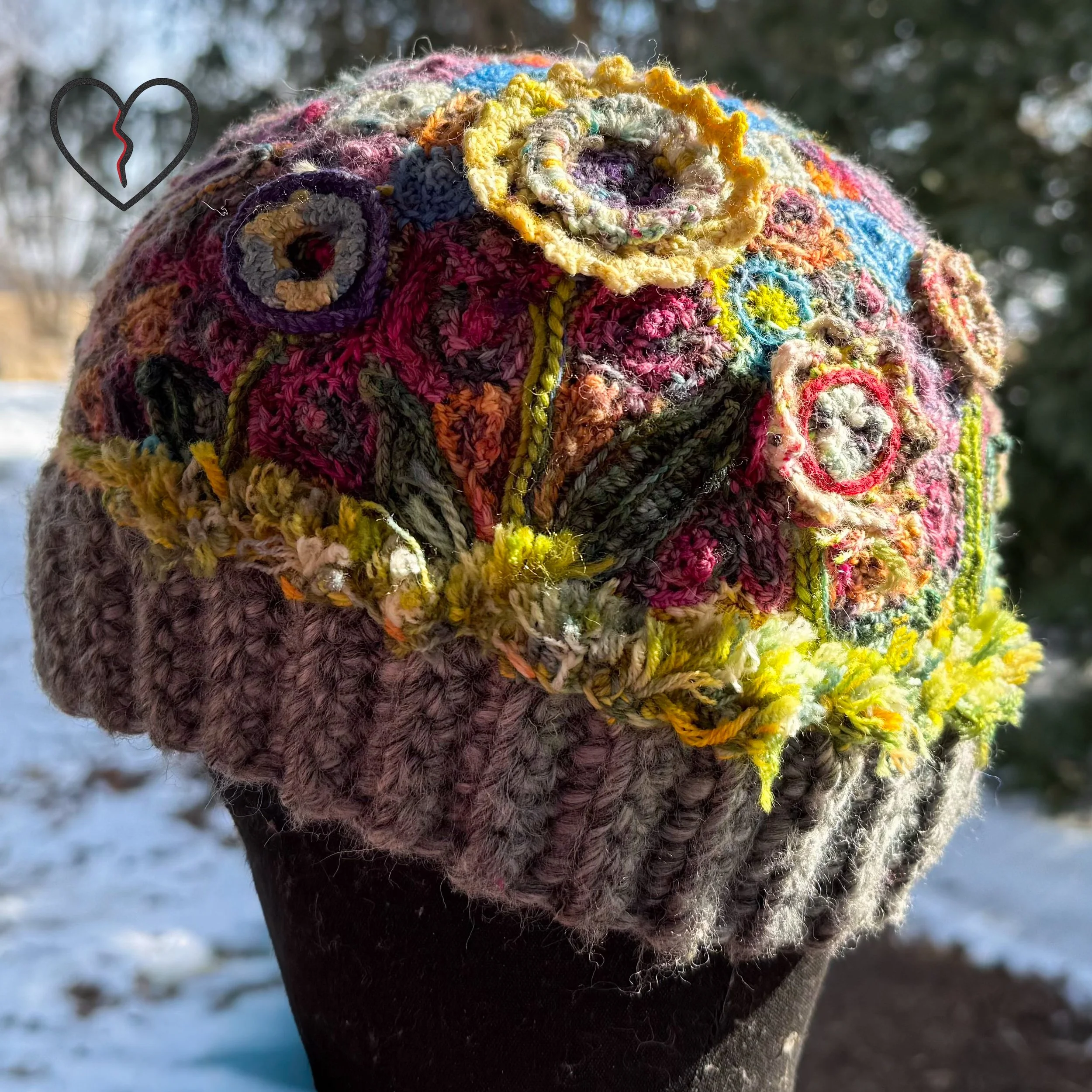 Rear floral field showing blooming garden textures and sculptural dimensional crochet