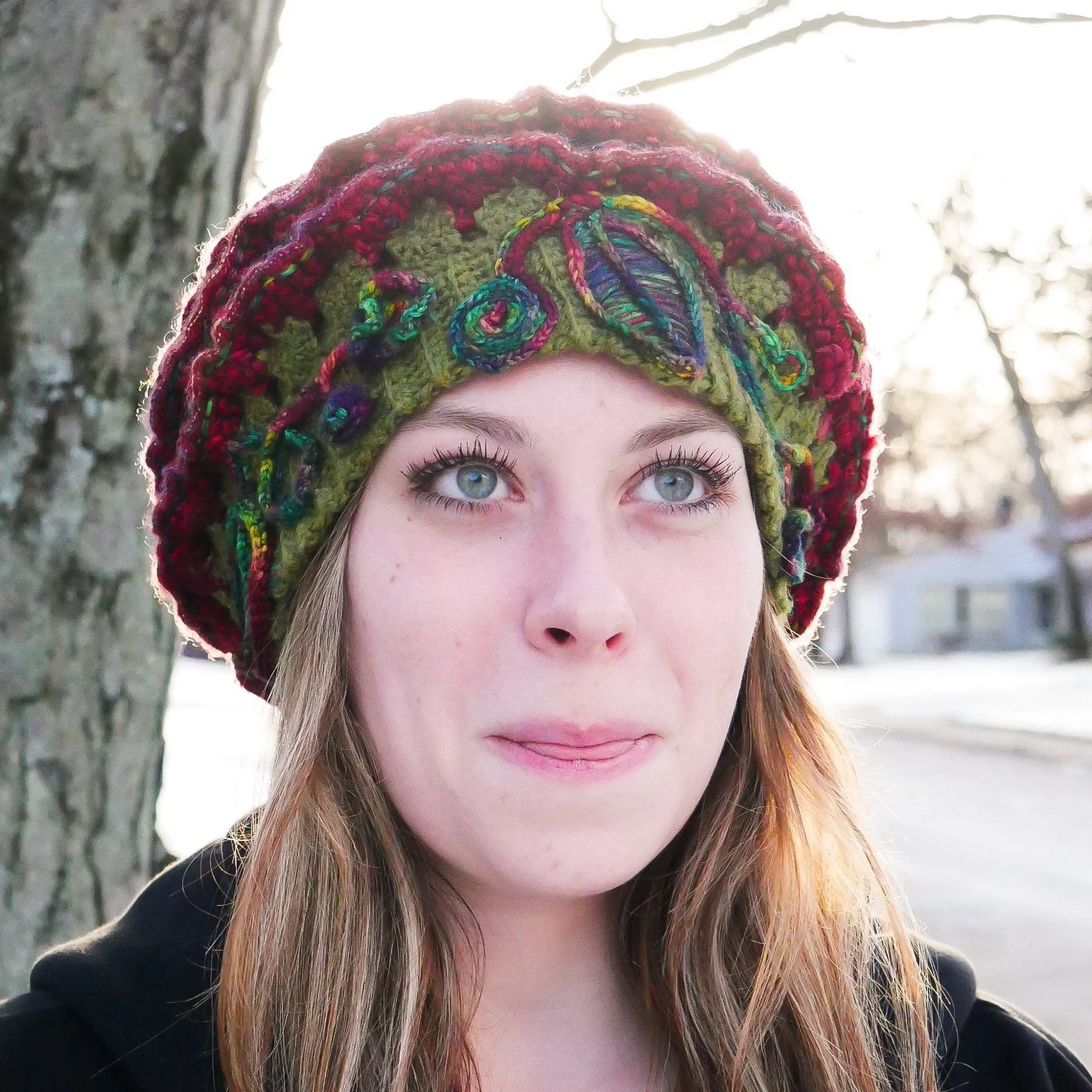 ront portrait of The Cosmic Rose worn on the head demonstrates how the sculptural crochet rose functions as wearable art, balancing weight, structure, and adornment.