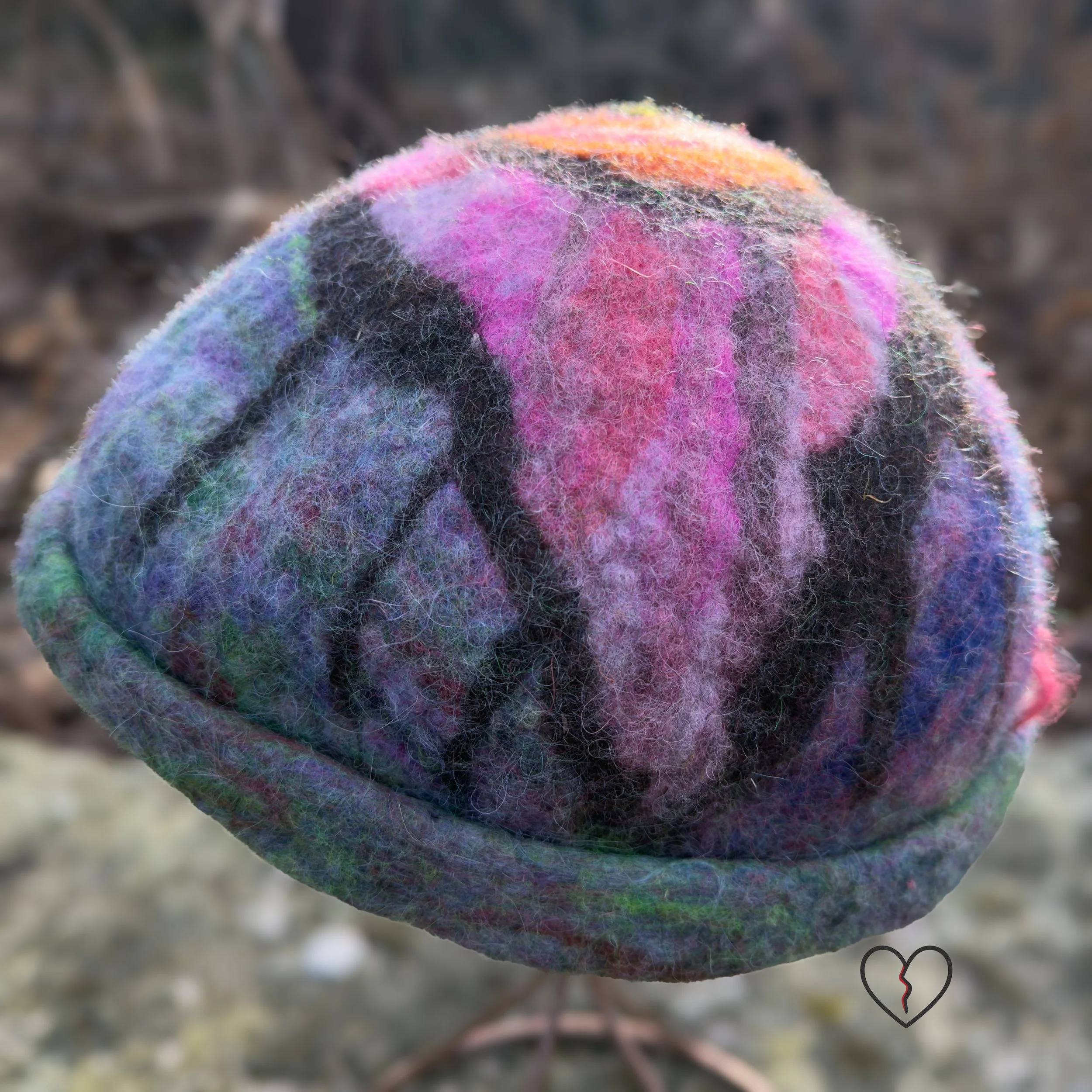 Hand-felted wool hat with a symbolic eye and celestial purple-blue design.
