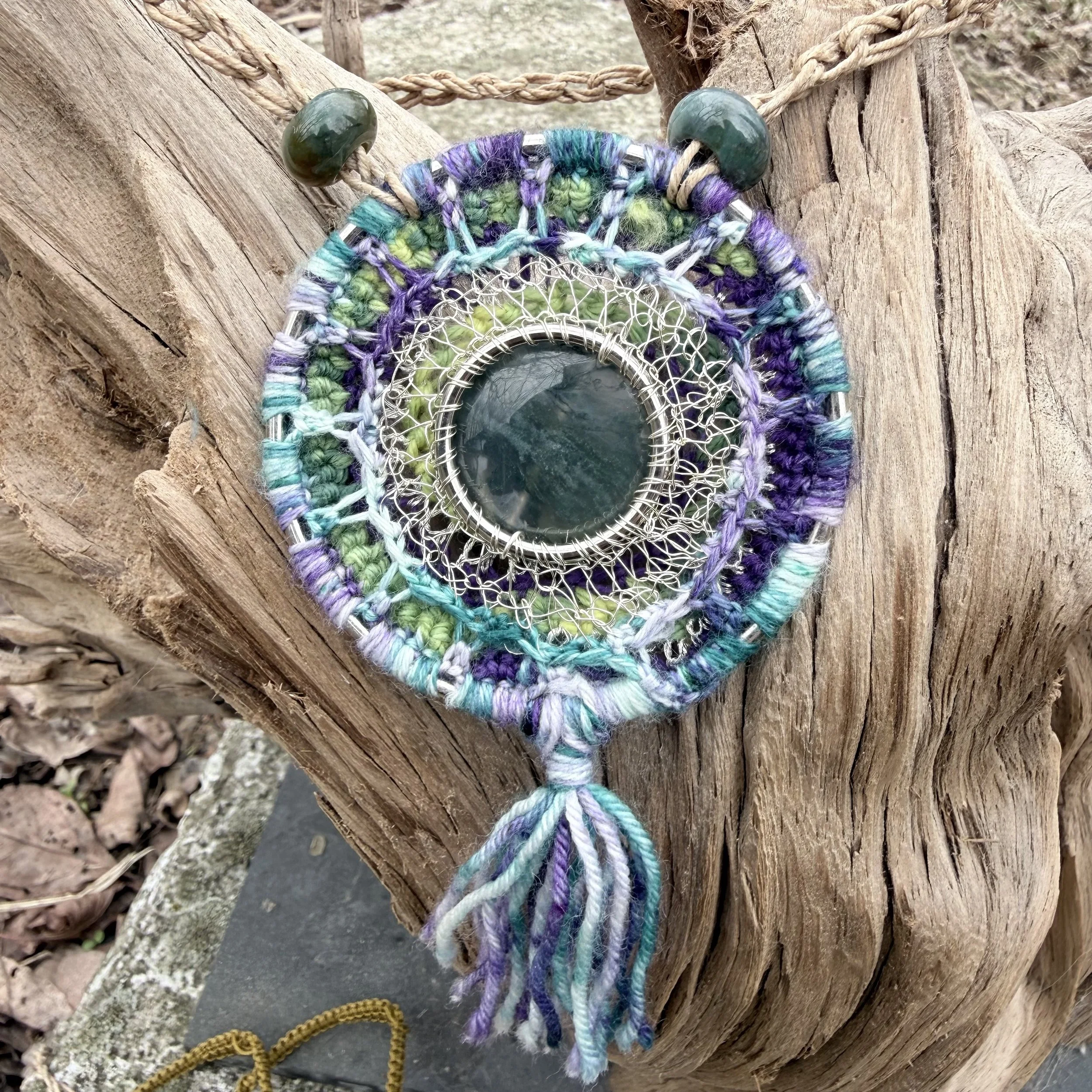 Spring Forest Amulet with moss agate center, crocheted wool and wire setting, serpentine beads