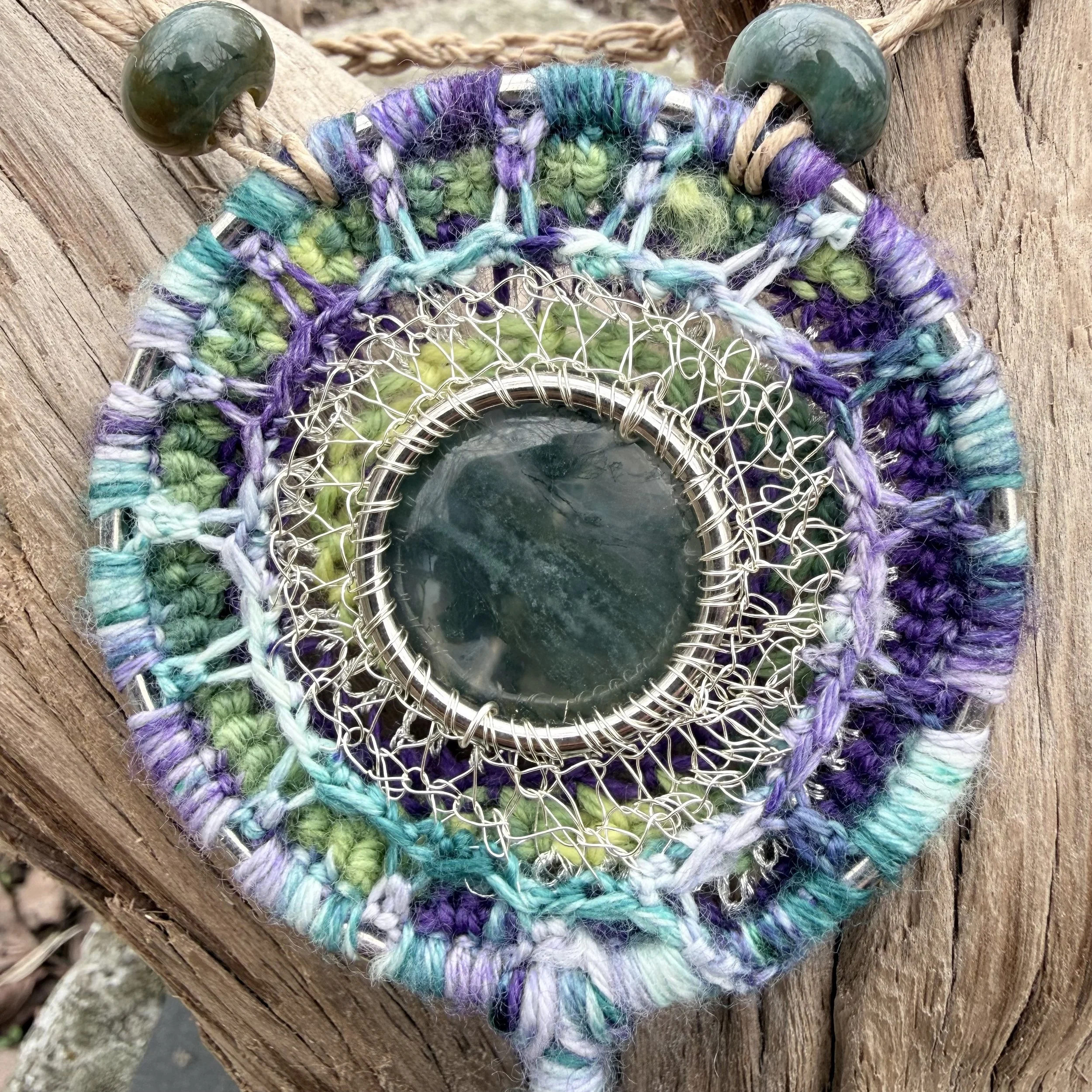 Spring Forest Amulet with moss agate center, crocheted wool and wire setting, serpentine beads