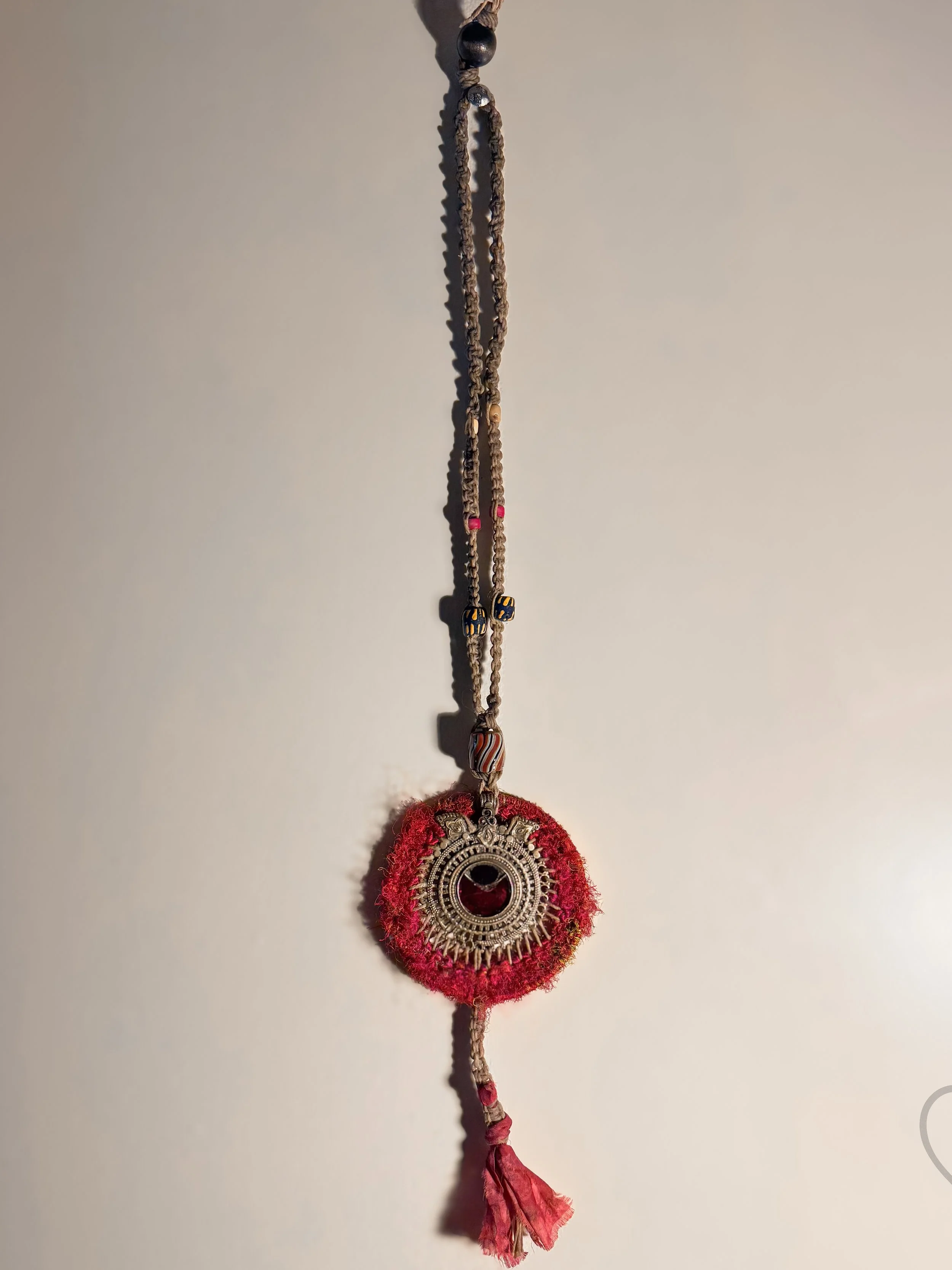 Fiber art necklace with reclaimed pendant, sari silk halo and macrame hemp cord by Kristi Yapp