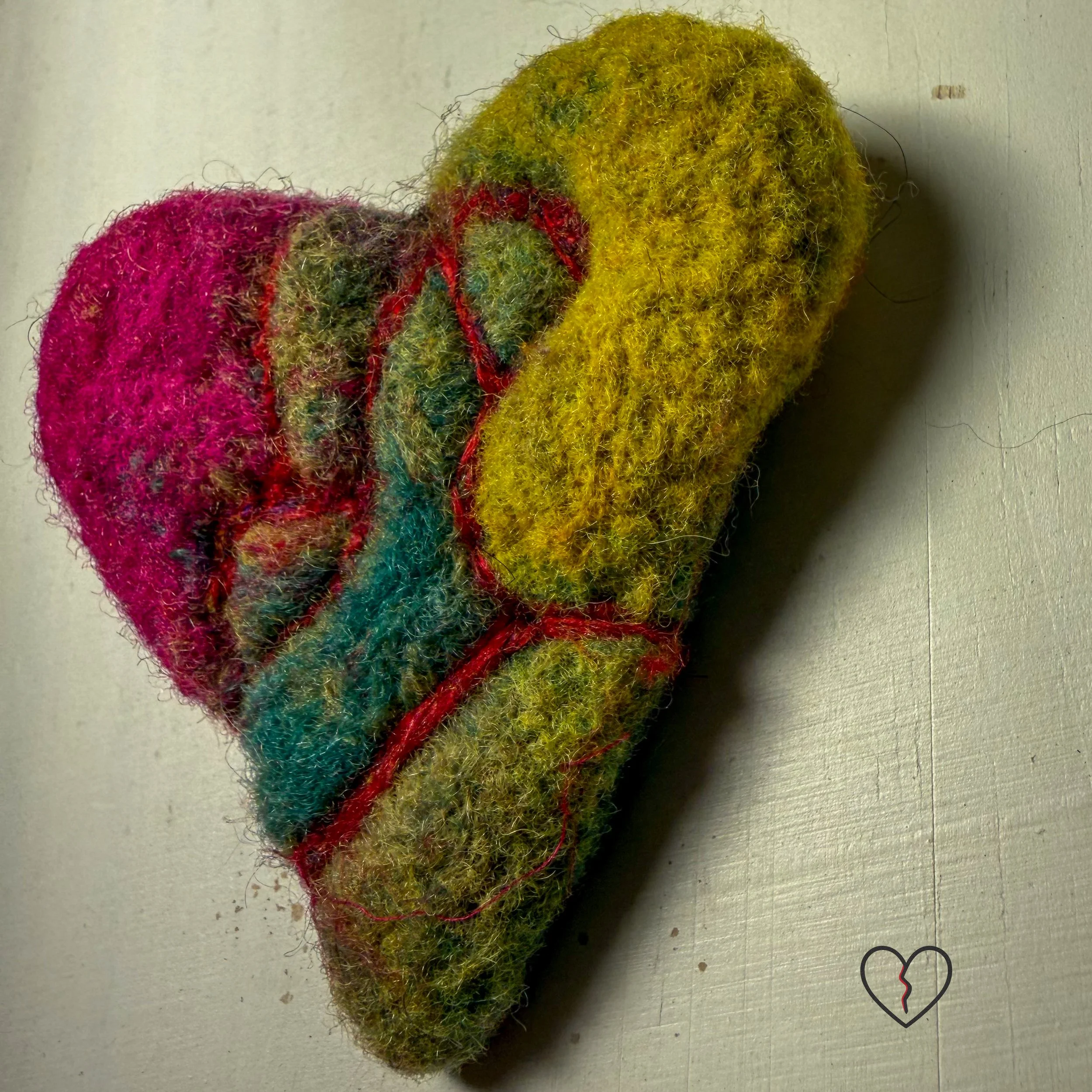 Handmade needle felted wool art pin by fiber artist Kristi Yapp. One of a kind, lightweight, and sculptural wearable fiber art.