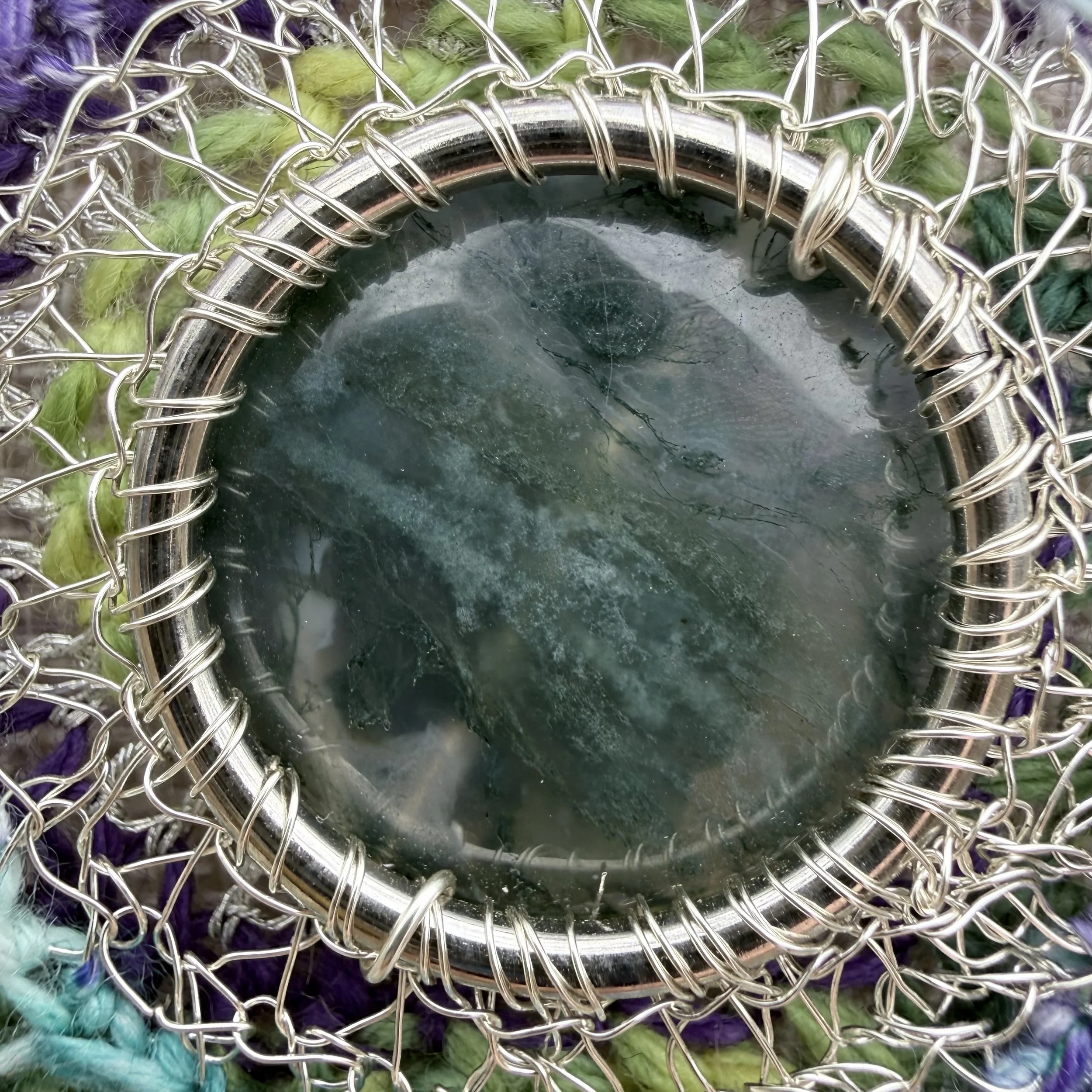 Spring Forest Amulet with moss agate center, crocheted wool and wire setting, serpentine beads